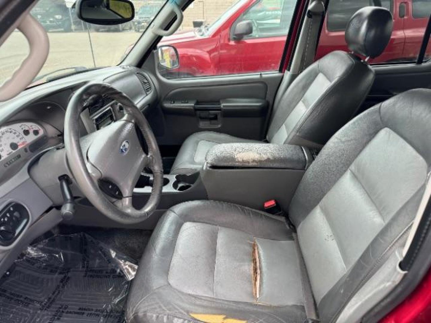 2004 Red Fire Metallic /Medium Dark Flint Cloth Interior Ford Explorer Sport Trac XLT 2WD (1FMZU67K24U) with an 4.0L V6 SOHC 12V FFV engine, 5-Speed Automatic transmission, located at 1865 East Red Hills Pkwy, St. George, 84770, (435) 628-0023, 37.120850, -113.543640 - This vehicle is a Mechanic Special. This means it will need some love. Runs a drives fine but has body damage, leaks or other mechanical issues. It did NOT pass our 50 point inspection. Get a great deal on a less than perfect car. These cars do NOT qualify for our in house financing. Cash and carry, - Photo#10