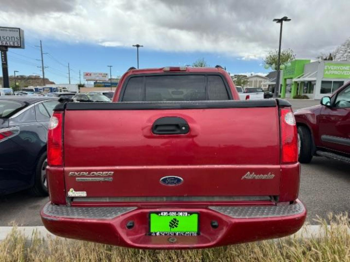 2004 Red Fire Metallic /Medium Dark Flint Cloth Interior Ford Explorer Sport Trac XLT 2WD (1FMZU67K24U) with an 4.0L V6 SOHC 12V FFV engine, 5-Speed Automatic transmission, located at 1865 East Red Hills Pkwy, St. George, 84770, (435) 628-0023, 37.120850, -113.543640 - This vehicle is a Mechanic Special. This means it will need some love. Runs a drives fine but has body damage, leaks or other mechanical issues. It did NOT pass our 50 point inspection. Get a great deal on a less than perfect car. These cars do NOT qualify for our in house financing. Cash and carry, - Photo#4