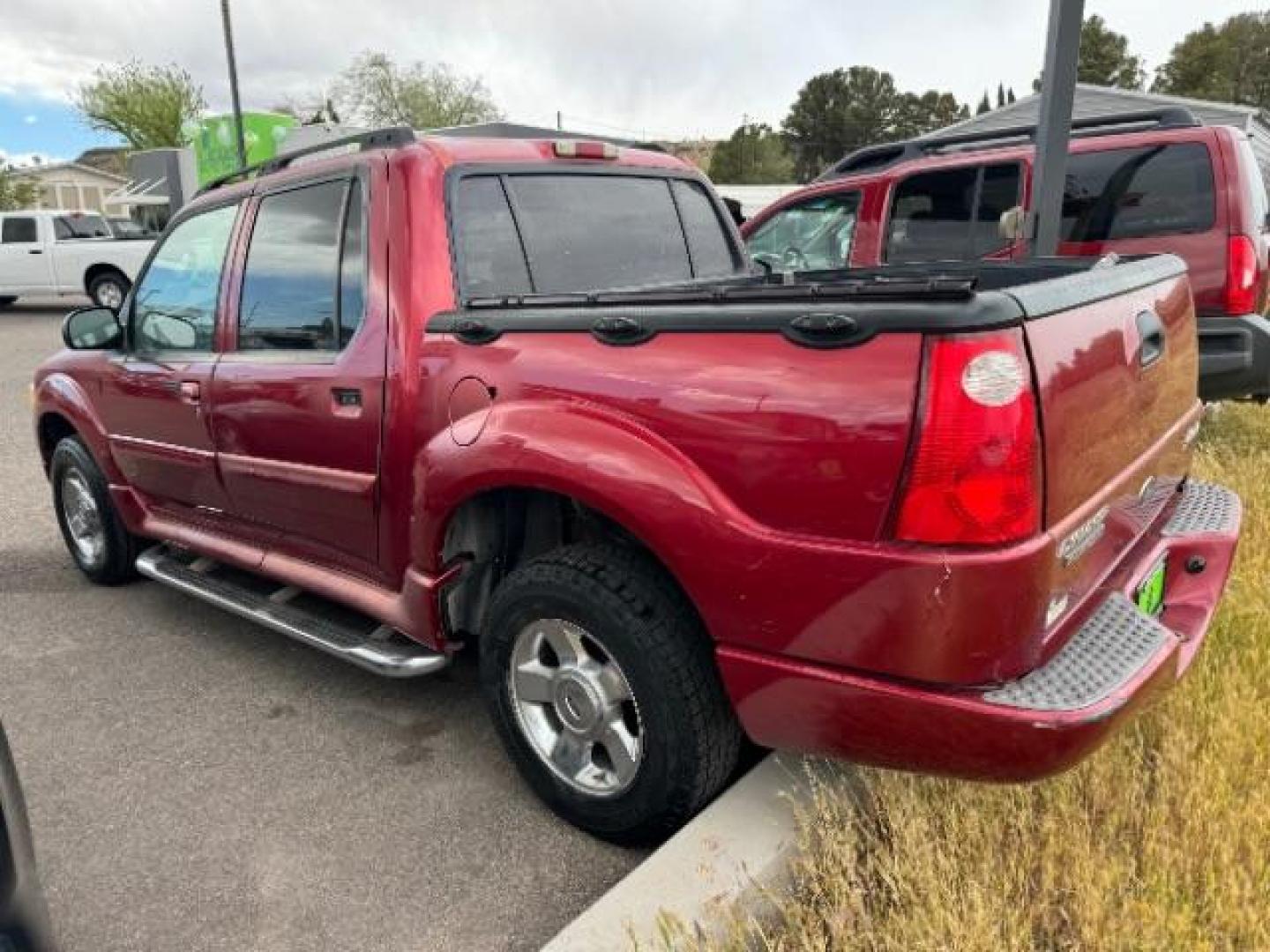 2004 Red Fire Metallic /Medium Dark Flint Cloth Interior Ford Explorer Sport Trac XLT 2WD (1FMZU67K24U) with an 4.0L V6 SOHC 12V FFV engine, 5-Speed Automatic transmission, located at 1865 East Red Hills Pkwy, St. George, 84770, (435) 628-0023, 37.120850, -113.543640 - This vehicle is a Mechanic Special. This means it will need some love. Runs a drives fine but has body damage, leaks or other mechanical issues. It did NOT pass our 50 point inspection. Get a great deal on a less than perfect car. These cars do NOT qualify for our in house financing. Cash and carry, - Photo#5