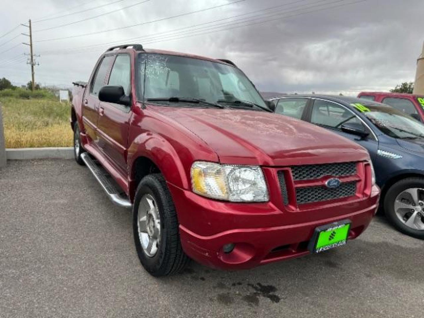 2004 Red Fire Metallic /Medium Dark Flint Cloth Interior Ford Explorer Sport Trac XLT 2WD (1FMZU67K24U) with an 4.0L V6 SOHC 12V FFV engine, 5-Speed Automatic transmission, located at 1865 East Red Hills Pkwy, St. George, 84770, (435) 628-0023, 37.120850, -113.543640 - This vehicle is a Mechanic Special. This means it will need some love. Runs a drives fine but has body damage, leaks or other mechanical issues. It did NOT pass our 50 point inspection. Get a great deal on a less than perfect car. These cars do NOT qualify for our in house financing. Cash and carry, - Photo#0