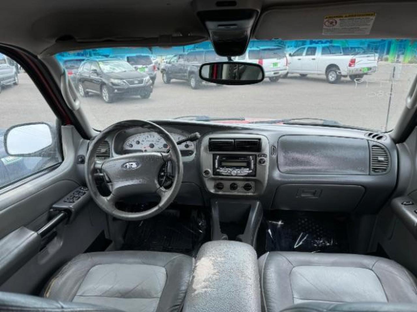 2004 Red Fire Metallic /Medium Dark Flint Cloth Interior Ford Explorer Sport Trac XLT 2WD (1FMZU67K24U) with an 4.0L V6 SOHC 12V FFV engine, 5-Speed Automatic transmission, located at 1865 East Red Hills Pkwy, St. George, 84770, (435) 628-0023, 37.120850, -113.543640 - This vehicle is a Mechanic Special. This means it will need some love. Runs a drives fine but has body damage, leaks or other mechanical issues. It did NOT pass our 50 point inspection. Get a great deal on a less than perfect car. These cars do NOT qualify for our in house financing. Cash and carry, - Photo#12
