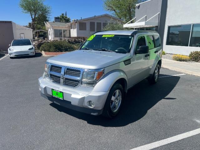 2008 Bright Silver Metallic /Dark Khaki Cloth Seats Dodge Nitro SXT 4WD (1D8GU28K28W) with an 3.7L V6 SOHC 12V engine, 4-Speed Automatic transmission, located at 940 North Main Street, Cedar City, UT, 84720, (435) 628-0023, 37.692936, -113.061897 - 2008 Dodge Nitro SXT 4WD - Rugged Power at an Unbeatable Price! Built tough and loaded with features, this Bright Silver Metallic Dodge Nitro SXT 4WD is ready for whatever the road throws at you. Whether you are tackling back roads or handling daily commutes, this capable SUV delivers serious capab - Photo#2