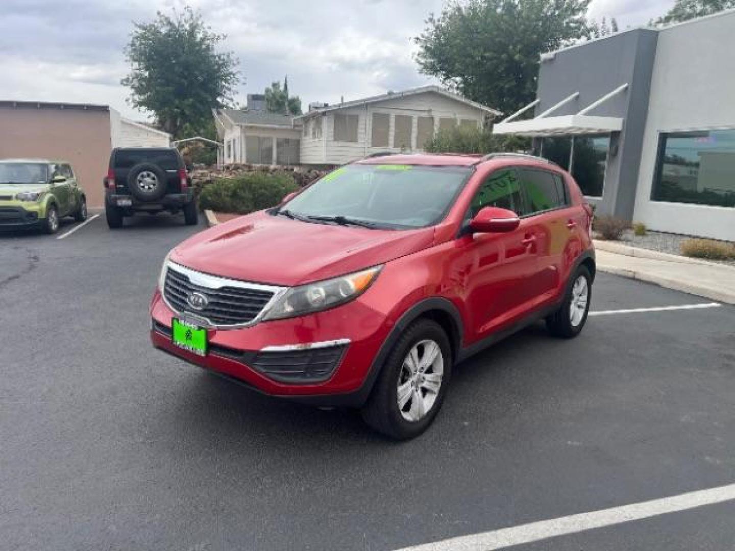 2011 Signal Red Metallic /Alpine Gray Cloth In Kia Sportage LX FWD (KNDPB3A27B7) with an 2.4L V6 DOHC 24V engine, 6-Speed Automatic transmission, located at 940 North Main Street, Cedar City, UT, 84720, (435) 628-0023, 37.692936, -113.061897 - We specialize in helping ALL people get the best financing available. No matter your credit score, good, bad or none we can get you an amazing rate. Had a bankruptcy, divorce, or repossessions? We give you the green light to get your credit back on the road. Low down and affordable payments that fit - Photo#2
