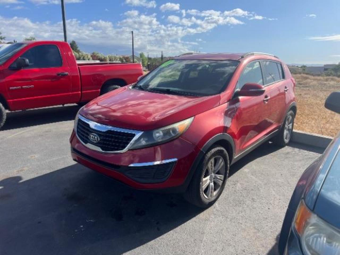 2011 Signal Red Metallic /Alpine Gray Cloth Interior Kia Sportage LX FWD (KNDPB3A27B7) with an 2.4L V6 DOHC 24V engine, 6-Speed Automatic transmission, located at 1865 East Red Hills Pkwy, St. George, 84770, (435) 628-0023, 37.120850, -113.543640 - This vehicle is a Mechanic Special. This means it will need some love. Runs a drives fine but has body damage, leaks or other mechanical issues. It did NOT pass our 50 point inspection. Get a great deal on a less than perfect car. These cars do NOT qualify for our in house financing. Cash and carry,- Photo#2