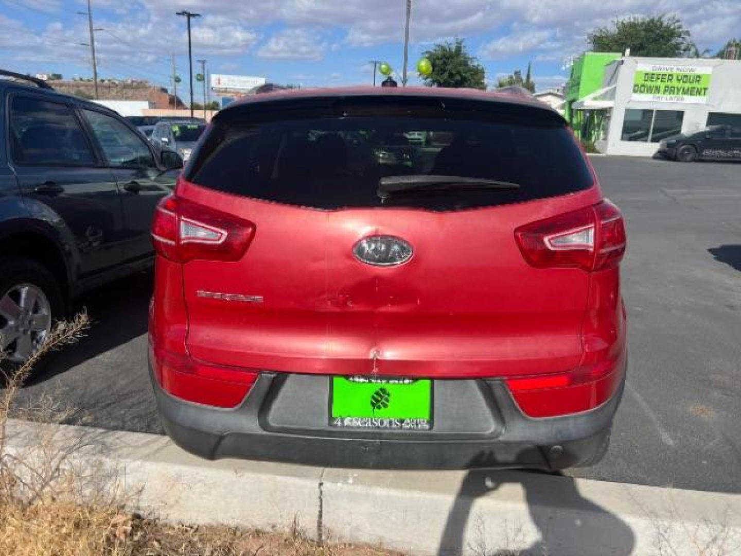 2011 Signal Red Metallic /Alpine Gray Cloth Interior Kia Sportage LX FWD (KNDPB3A27B7) with an 2.4L V6 DOHC 24V engine, 6-Speed Automatic transmission, located at 1865 East Red Hills Pkwy, St. George, 84770, (435) 628-0023, 37.120850, -113.543640 - This vehicle is a Mechanic Special. This means it will need some love. Runs a drives fine but has body damage, leaks or other mechanical issues. It did NOT pass our 50 point inspection. Get a great deal on a less than perfect car. These cars do NOT qualify for our in house financing. Cash and carry,- Photo#3
