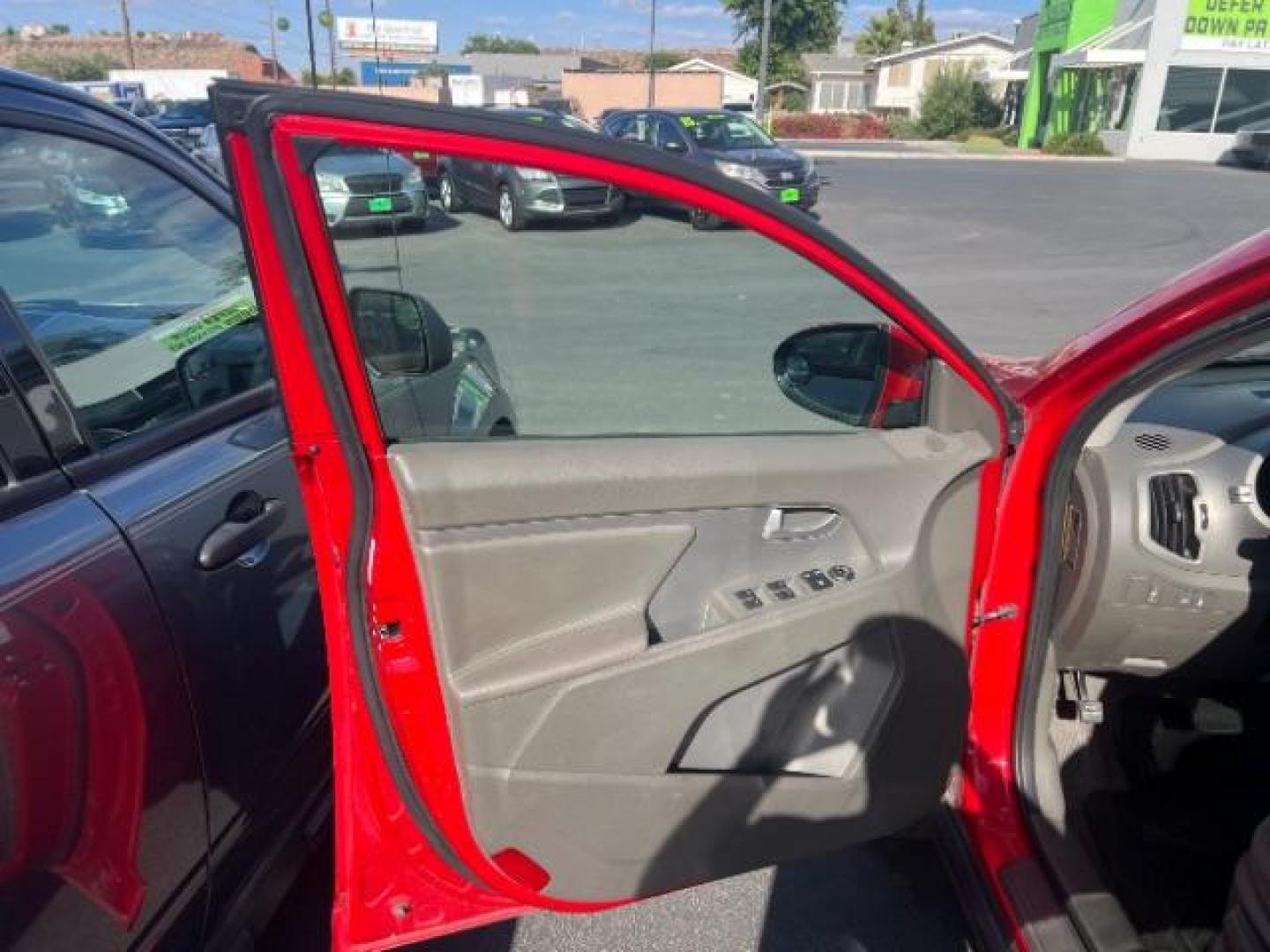2011 Signal Red Metallic /Alpine Gray Cloth Interior Kia Sportage LX FWD (KNDPB3A27B7) with an 2.4L V6 DOHC 24V engine, 6-Speed Automatic transmission, located at 1865 East Red Hills Pkwy, St. George, 84770, (435) 628-0023, 37.120850, -113.543640 - This vehicle is a Mechanic Special. This means it will need some love. Runs a drives fine but has body damage, leaks or other mechanical issues. It did NOT pass our 50 point inspection. Get a great deal on a less than perfect car. These cars do NOT qualify for our in house financing. Cash and carry,- Photo#4