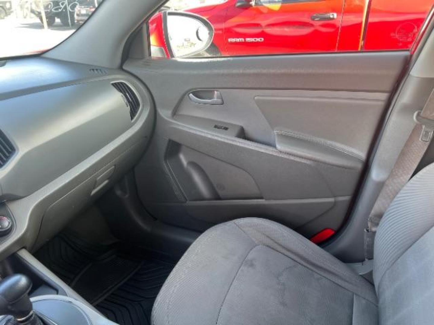 2011 Signal Red Metallic /Alpine Gray Cloth Interior Kia Sportage LX FWD (KNDPB3A27B7) with an 2.4L V6 DOHC 24V engine, 6-Speed Automatic transmission, located at 1865 East Red Hills Pkwy, St. George, 84770, (435) 628-0023, 37.120850, -113.543640 - This vehicle is a Mechanic Special. This means it will need some love. Runs a drives fine but has body damage, leaks or other mechanical issues. It did NOT pass our 50 point inspection. Get a great deal on a less than perfect car. These cars do NOT qualify for our in house financing. Cash and carry,- Photo#12