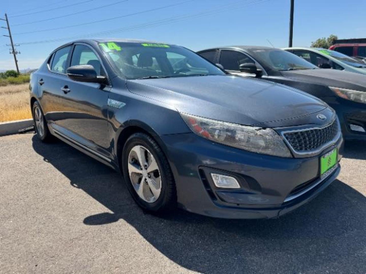 2014 Smokey Blue Metallic /Beige Kia Optima Hybrid LX (KNAGM4AD9E5) with an 2.4L L4 DOHC 16V HYBRID engine, 6-Speed Automatic transmission, located at 1865 East Red Hills Pkwy, St. George, 84770, (435) 628-0023, 37.120850, -113.543640 - This vehicle is a Mechanic Special. This means it will need some love. Runs a drives fine but has body damage, leaks or other mechanical issues. It did NOT pass our 50 point inspection. Get a great deal on a less than perfect car. These cars do NOT qualify for our in house financing. Cash and carry, - Photo#0