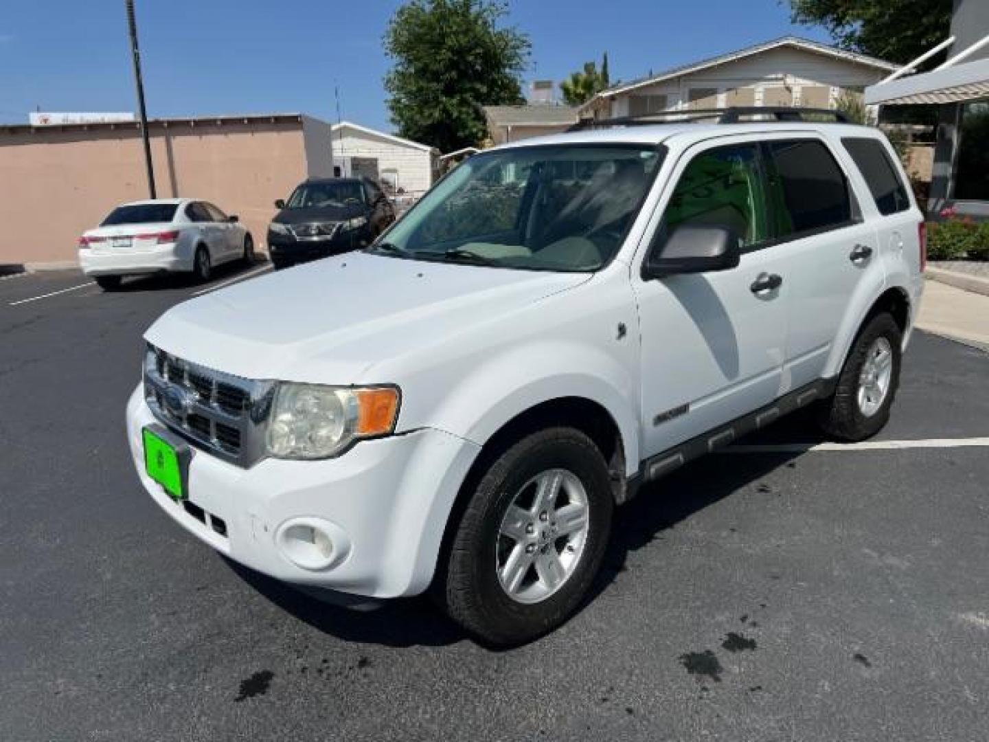 2008 Oxford White /Tan Leather Interior Ford Escape Hybrid FWD (1FMCU49H98K) with an 2.3L L4 DOHC 16V HYBRID engine, Continuously Variable Transmission transmission, located at 1865 East Red Hills Pkwy, St. George, 84770, (435) 628-0023, 37.120850, -113.543640 - This vehicle is a Mechanic Special. This means it will need some love. Runs a drives fine but has body damage, leaks or other mechanical issues. It did NOT pass our 50 point inspection. Get a great deal on a less than perfect car. These cars do NOT qualify for our in house financing. Cash and carry, - Photo#2