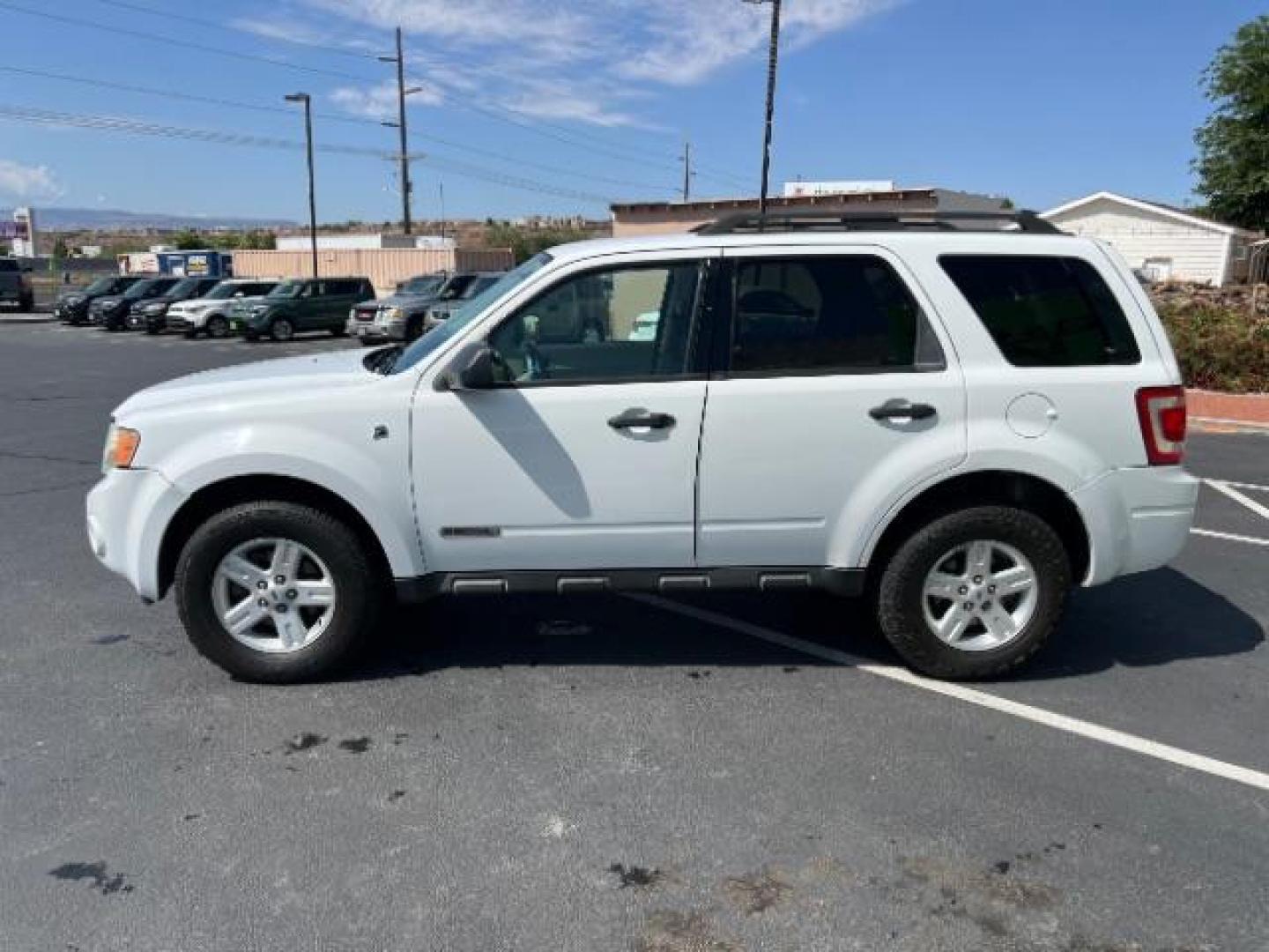 2008 Oxford White /Tan Leather Interior Ford Escape Hybrid FWD (1FMCU49H98K) with an 2.3L L4 DOHC 16V HYBRID engine, Continuously Variable Transmission transmission, located at 1865 East Red Hills Pkwy, St. George, 84770, (435) 628-0023, 37.120850, -113.543640 - This vehicle is a Mechanic Special. This means it will need some love. Runs a drives fine but has body damage, leaks or other mechanical issues. It did NOT pass our 50 point inspection. Get a great deal on a less than perfect car. These cars do NOT qualify for our in house financing. Cash and carry, - Photo#3