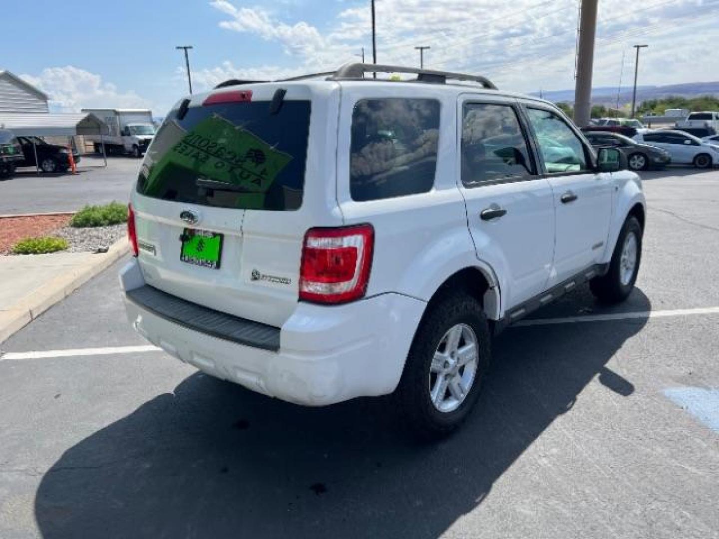 2008 Oxford White /Tan Leather Interior Ford Escape Hybrid FWD (1FMCU49H98K) with an 2.3L L4 DOHC 16V HYBRID engine, Continuously Variable Transmission transmission, located at 1865 East Red Hills Pkwy, St. George, 84770, (435) 628-0023, 37.120850, -113.543640 - This vehicle is a Mechanic Special. This means it will need some love. Runs a drives fine but has body damage, leaks or other mechanical issues. It did NOT pass our 50 point inspection. Get a great deal on a less than perfect car. These cars do NOT qualify for our in house financing. Cash and carry, - Photo#4
