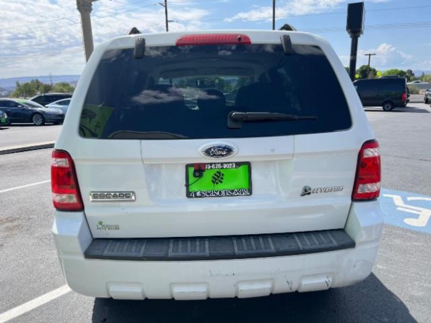 2008 Oxford White /Tan Leather Interior Ford Escape Hybrid FWD (1FMCU49H98K) with an 2.3L L4 DOHC 16V HYBRID engine, Continuously Variable Transmission transmission, located at 1865 East Red Hills Pkwy, St. George, 84770, (435) 628-0023, 37.120850, -113.543640 - This vehicle is a Mechanic Special. This means it will need some love. Runs a drives fine but has body damage, leaks or other mechanical issues. It did NOT pass our 50 point inspection. Get a great deal on a less than perfect car. These cars do NOT qualify for our in house financing. Cash and carry, - Photo#5