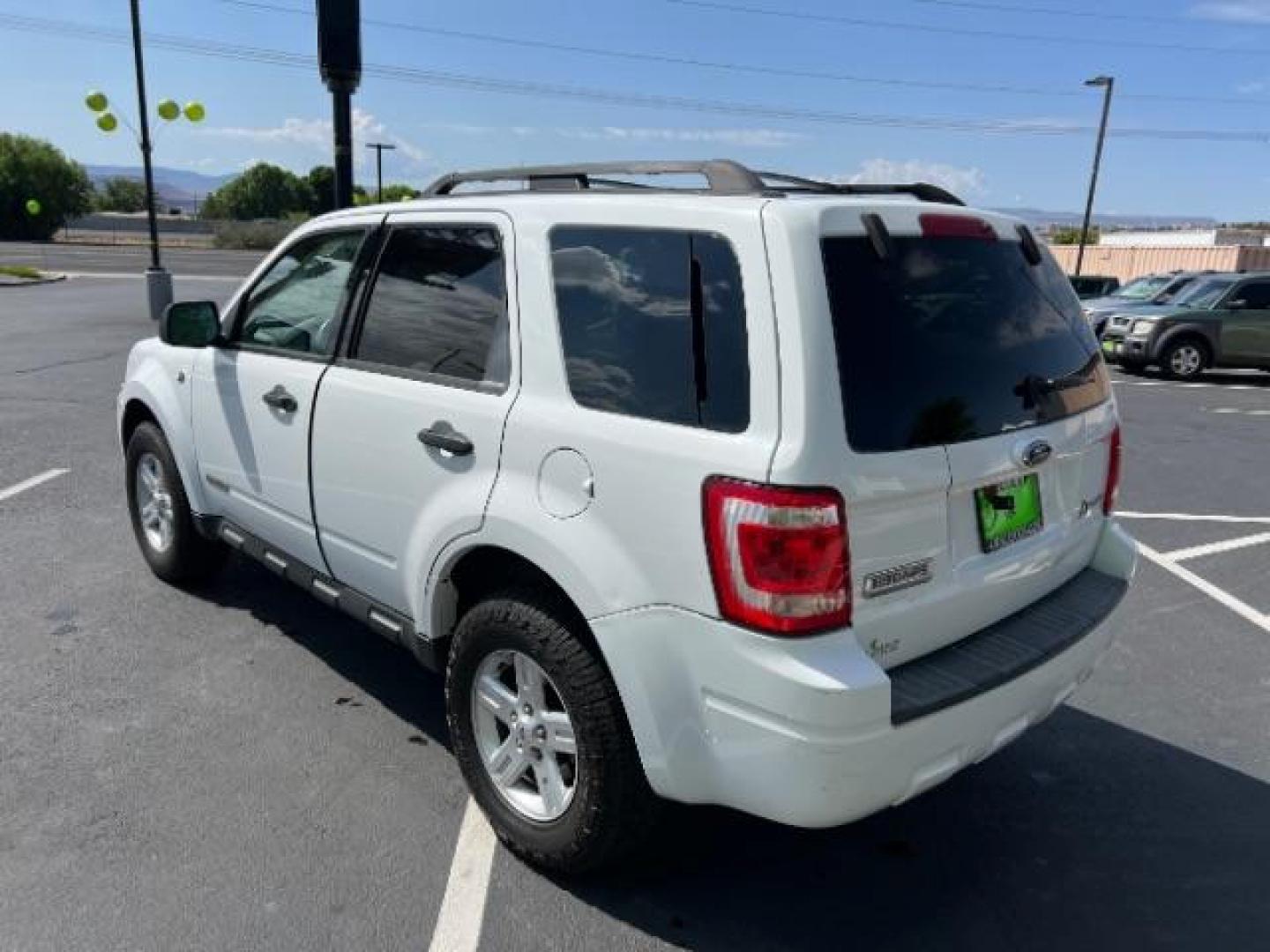 2008 Oxford White /Tan Leather Interior Ford Escape Hybrid FWD (1FMCU49H98K) with an 2.3L L4 DOHC 16V HYBRID engine, Continuously Variable Transmission transmission, located at 1865 East Red Hills Pkwy, St. George, 84770, (435) 628-0023, 37.120850, -113.543640 - This vehicle is a Mechanic Special. This means it will need some love. Runs a drives fine but has body damage, leaks or other mechanical issues. It did NOT pass our 50 point inspection. Get a great deal on a less than perfect car. These cars do NOT qualify for our in house financing. Cash and carry, - Photo#6