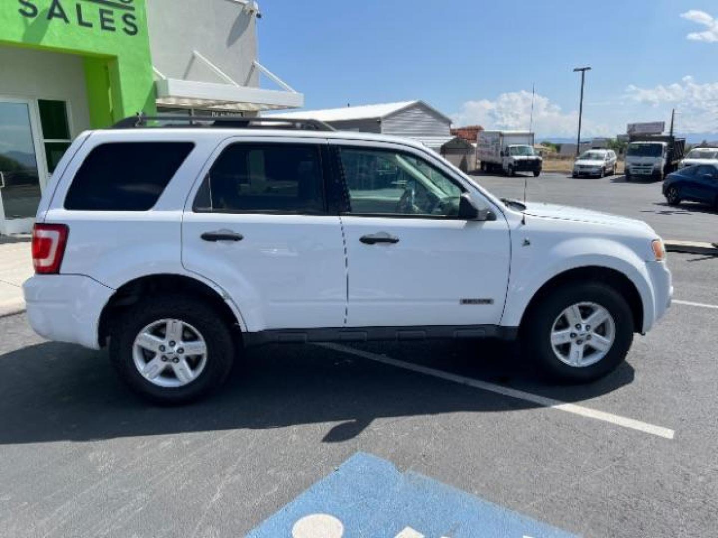 2008 Oxford White /Tan Leather Interior Ford Escape Hybrid FWD (1FMCU49H98K) with an 2.3L L4 DOHC 16V HYBRID engine, Continuously Variable Transmission transmission, located at 1865 East Red Hills Pkwy, St. George, 84770, (435) 628-0023, 37.120850, -113.543640 - This vehicle is a Mechanic Special. This means it will need some love. Runs a drives fine but has body damage, leaks or other mechanical issues. It did NOT pass our 50 point inspection. Get a great deal on a less than perfect car. These cars do NOT qualify for our in house financing. Cash and carry, - Photo#9