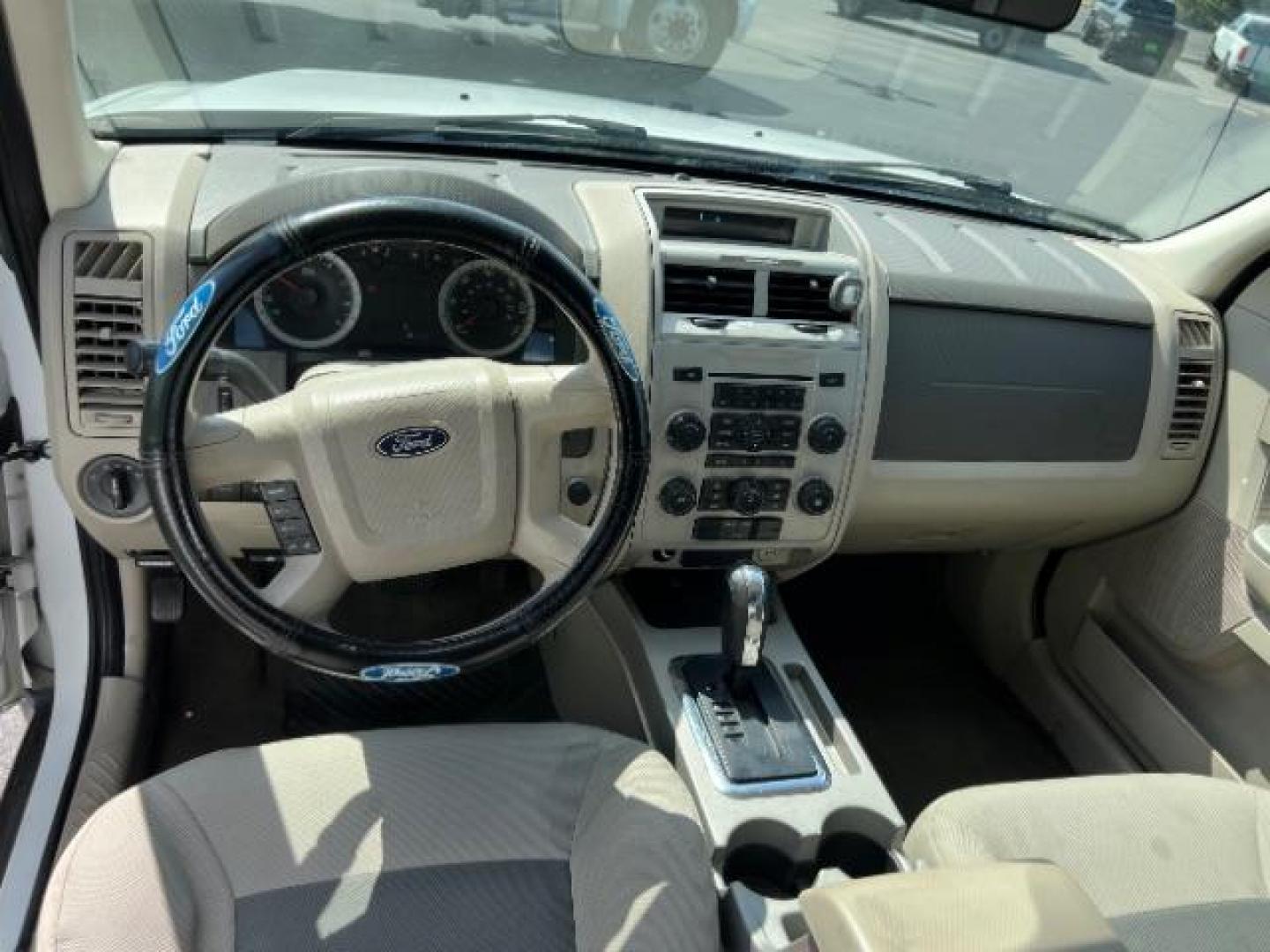 2008 Oxford White /Tan Leather Interior Ford Escape Hybrid FWD (1FMCU49H98K) with an 2.3L L4 DOHC 16V HYBRID engine, Continuously Variable Transmission transmission, located at 1865 East Red Hills Pkwy, St. George, 84770, (435) 628-0023, 37.120850, -113.543640 - This vehicle is a Mechanic Special. This means it will need some love. Runs a drives fine but has body damage, leaks or other mechanical issues. It did NOT pass our 50 point inspection. Get a great deal on a less than perfect car. These cars do NOT qualify for our in house financing. Cash and carry, - Photo#10