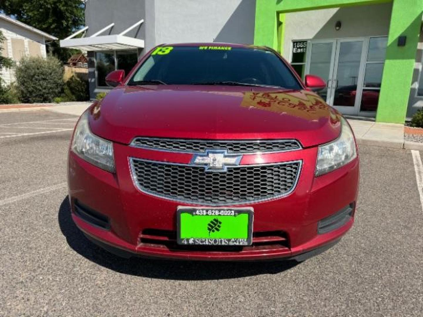 2013 Crystal Red Tintcoat /Jet Black Cloth Interior Chevrolet Cruze 1LT Auto (1G1PC5SB4D7) with an 1.4L L4 DOHC 16V TUR engine, 6-Speed Automatic transmission, located at 1865 East Red Hills Pkwy, St. George, 84770, (435) 628-0023, 37.120850, -113.543640 - We specialize in helping ALL people get the best financing available. No matter your credit score, good, bad or none we can get you an amazing rate. Had a bankruptcy, divorce, or repossessions? We give you the green light to get your credit back on the road. Low down and affordable payments that fit - Photo#1