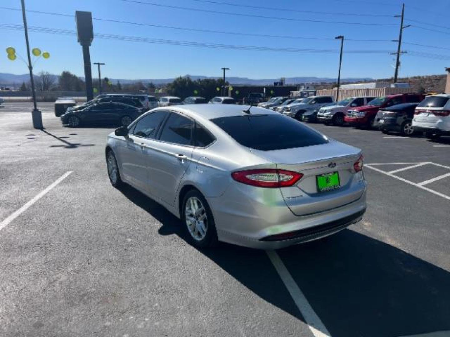 2016 Silver /Charcoal Black, clot Ford Fusion SE (3FA6P0HD0GR) with an 1.5L L4 DOHC 16V engine, 6-Speed Automatic transmission, located at 940 North Main Street, Cedar City, UT, 84720, (435) 628-0023, 37.692936, -113.061897 - We specialize in helping ALL people get the best financing available. No matter your credit score, good, bad or none we can get you an amazing rate. Had a bankruptcy, divorce, or repossessions? We give you the green light to get your credit back on the road. Low down and affordable payments that fit - Photo#4