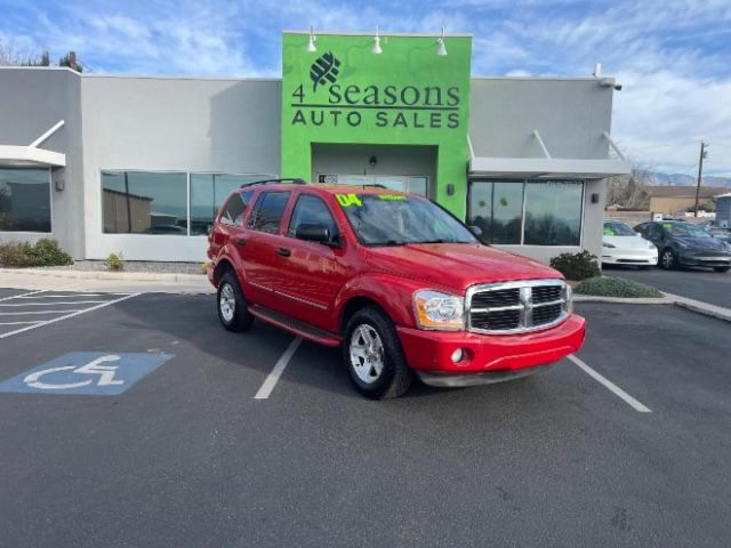 2004 Flame Red /Dark Khaki/Light Graystone Leather Interior Dodge Durango Limited 2WD (1D8HD58D14F) with an 5.7L V8 OHV 16V engine, 5-Speed Automatic transmission, located at 1865 East Red Hills Pkwy, St. George, 84770, (435) 628-0023, 37.120850, -113.543640 - Looking for a roomy, reliable SUV loaded with comfort and style? This 2004 Dodge Durango Limited is a great pick! It comes packed with leather seats, heated front seats, power sunroof, running boards, alloy wheels, towing prep package, and so much more. Whether you need it for the family or the week - Photo#0