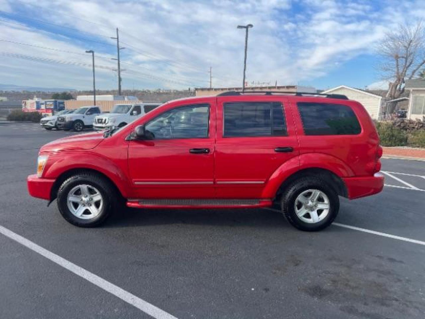 2004 Flame Red /Dark Khaki/Light Graystone Leather Interior Dodge Durango Limited 2WD (1D8HD58D14F) with an 5.7L V8 OHV 16V engine, 5-Speed Automatic transmission, located at 1865 East Red Hills Pkwy, St. George, 84770, (435) 628-0023, 37.120850, -113.543640 - Looking for a roomy, reliable SUV loaded with comfort and style? This 2004 Dodge Durango Limited is a great pick! It comes packed with leather seats, heated front seats, power sunroof, running boards, alloy wheels, towing prep package, and so much more. Whether you need it for the family or the week - Photo#3
