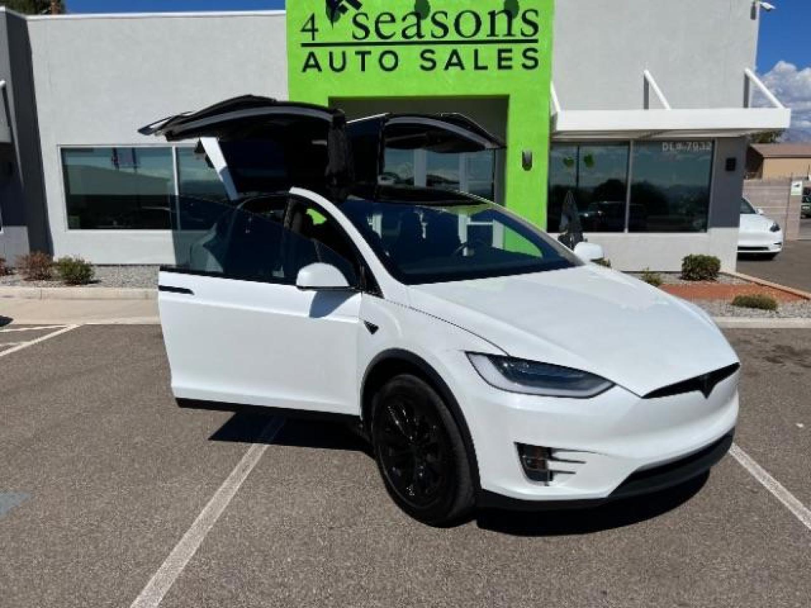 2019 Pearl White Multi-Coat /All Black, leatherette Tesla Model X Standard Range (5YJXCAE21KF) with an ELECTRIC engine, 1-Speed Automatic transmission, located at 1865 East Red Hills Pkwy, St. George, 84770, (435) 628-0023, 37.120850, -113.543640 - AWD, 7 Seats, Autopilot, Raven, Cold weather package, Adaptive suspension, Tow hitch, 2 remotes, FSD computer 3.0 upgrade. Gets 270 miles on a full charge. Black chrome delete vinyl (removeable). This is a beautiful 1 owner MX for way less money and less waiting compared to ordering from Tesla. Bump - Photo #0