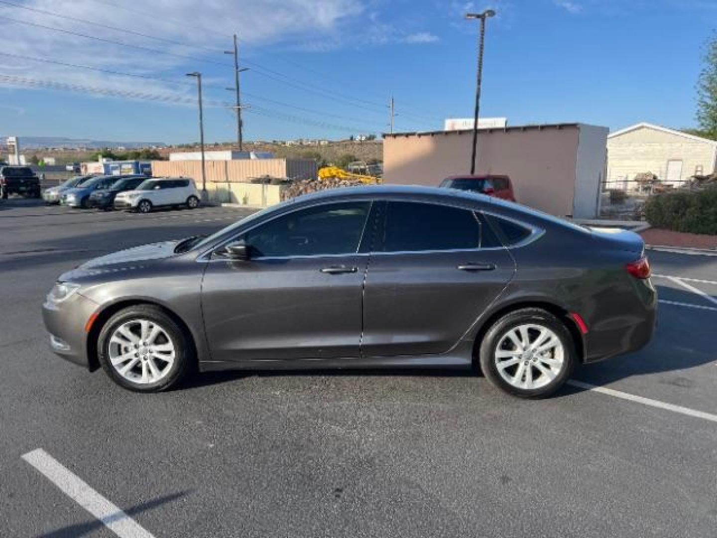 2015 Granite Crystal Met CC /Black Chrysler 200 Limited (1C3CCCAB5FN) with an 2.4L L4 DOHC 16V engine, 9-Speed Automatic transmission, located at 940 North Main Street, Cedar City, UT, 84720, (435) 628-0023, 37.692936, -113.061897 - We specialize in helping ALL people get the best financing available. No matter your credit score, good, bad or none we can get you an amazing rate. Had a bankruptcy, divorce, or repossessions? We give you the green light to get your credit back on the road. Low down and affordable payments that fit - Photo#3