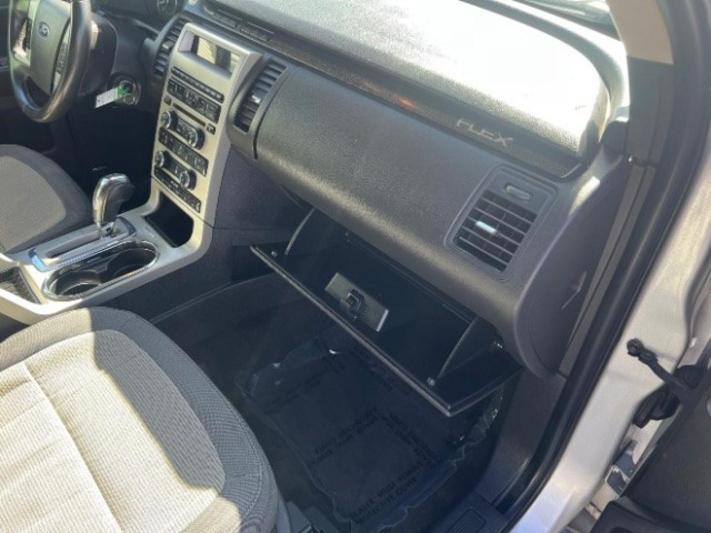 2011 Ingot Silver Metallic /Medium Light Stone Cloth Interior Ford Flex SE FWD (2FMGK5BC4BB) with an 3.5L V6 DOHC 24V engine, 6-Speed Automatic Overdrive transmission, located at 1865 East Red Hills Pkwy, St. George, 84770, (435) 628-0023, 37.120850, -113.543640 - Need three-row space on a budget? This Ingot Silver 2011 Ford Flex SE FWD brings a 3.5L V6, 6-speed automatic, and front-wheel drive - the unique Flex layout families still love around Southern Utah. We specialize in in-house financing and work with all credit types - good, fair, challenged, or reb- Photo#31