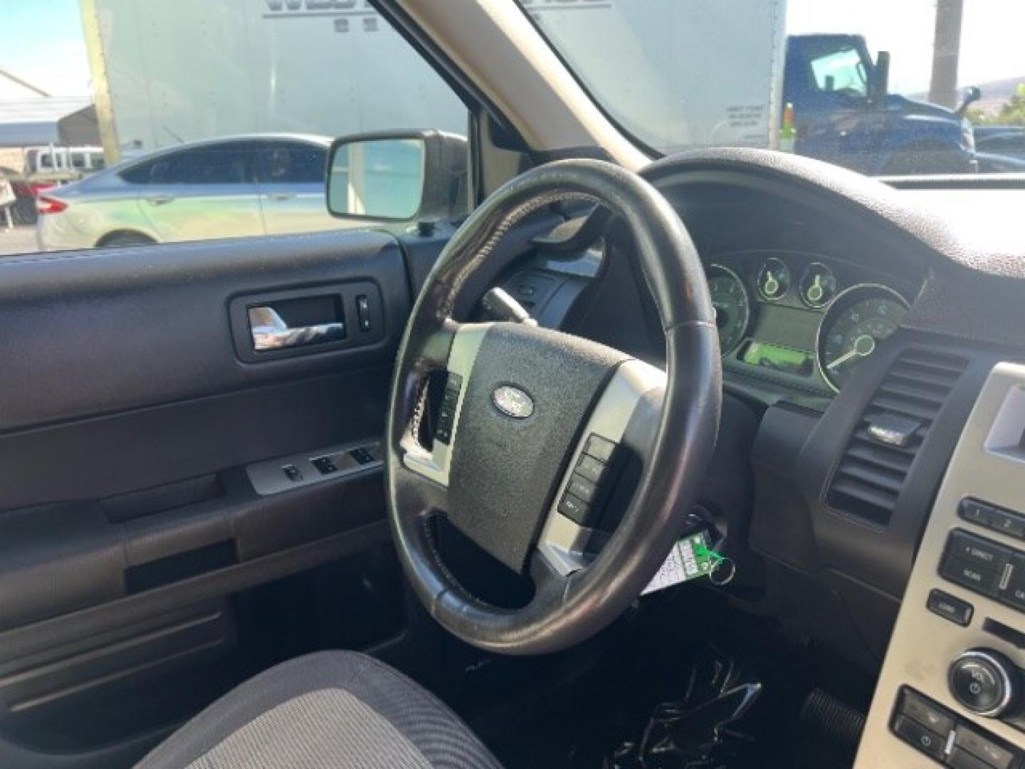 2011 Ingot Silver Metallic /Medium Light Stone Cloth Interior Ford Flex SE FWD (2FMGK5BC4BB) with an 3.5L V6 DOHC 24V engine, 6-Speed Automatic Overdrive transmission, located at 1865 East Red Hills Pkwy, St. George, 84770, (435) 628-0023, 37.120850, -113.543640 - Need three-row space on a budget? This Ingot Silver 2011 Ford Flex SE FWD brings a 3.5L V6, 6-speed automatic, and front-wheel drive - the unique Flex layout families still love around Southern Utah. We specialize in in-house financing and work with all credit types - good, fair, challenged, or reb- Photo#32