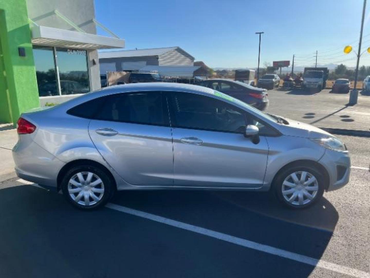 2012 Ingot Silver Metalli /Charcoal Black Cloth Ford Fiesta SE Sedan (3FADP4BJ2CM) with an 1.6L L4 DOHC 16V engine, 6-Speed Automatic transmission, located at 940 North Main Street, Cedar City, UT, 84720, (435) 628-0023, 37.692936, -113.061897 - Photo#7