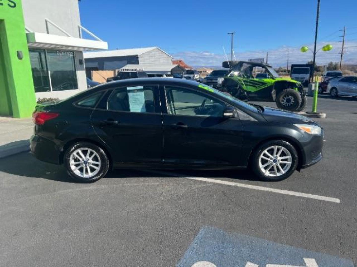 2015 Tuxedo Black Metalli /Charcoal Black Inser Ford Focus SE Sedan (1FADP3F21FL) with an 2.0L L4 DOHC 16V engine, 6-Speed Automatic transmission, located at 1865 East Red Hills Pkwy, St. George, 84770, (435) 628-0023, 37.120850, -113.543640 - Photo#7