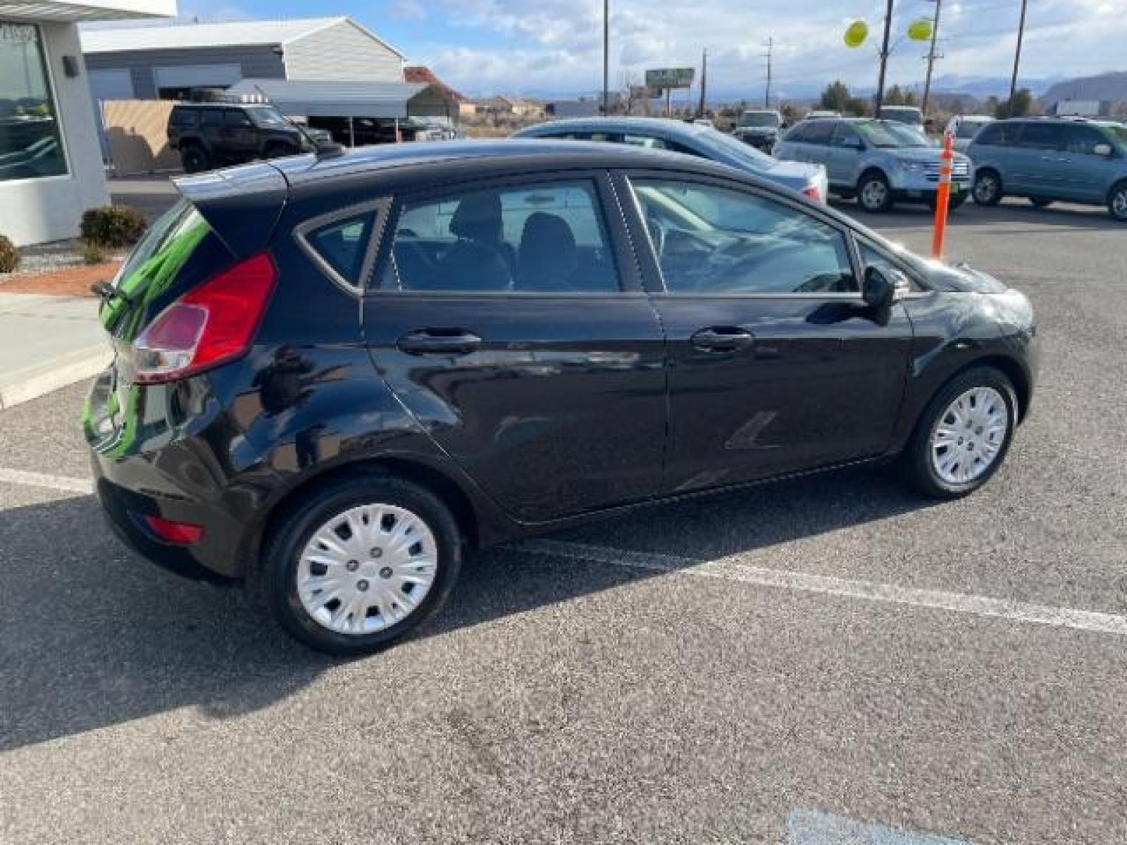 2014 Tuxedo Black Metallic /Charcoal Black Ford Fiesta SE Hatchback (3FADP4EJ0EM) with an 1.6L L4 DOHC 16V engine, 6-Speed Automatic transmission, located at 1865 East Red Hills Pkwy, St. George, 84770, (435) 628-0023, 37.120850, -113.543640 - We specialize in helping ALL people get the best financing available. No matter your credit score, good, bad or none we can get you an amazing rate. Had a bankruptcy, divorce, or repossessions? We give you the green light to get your credit back on the road. Low down and affordable payments that fit - Photo #9