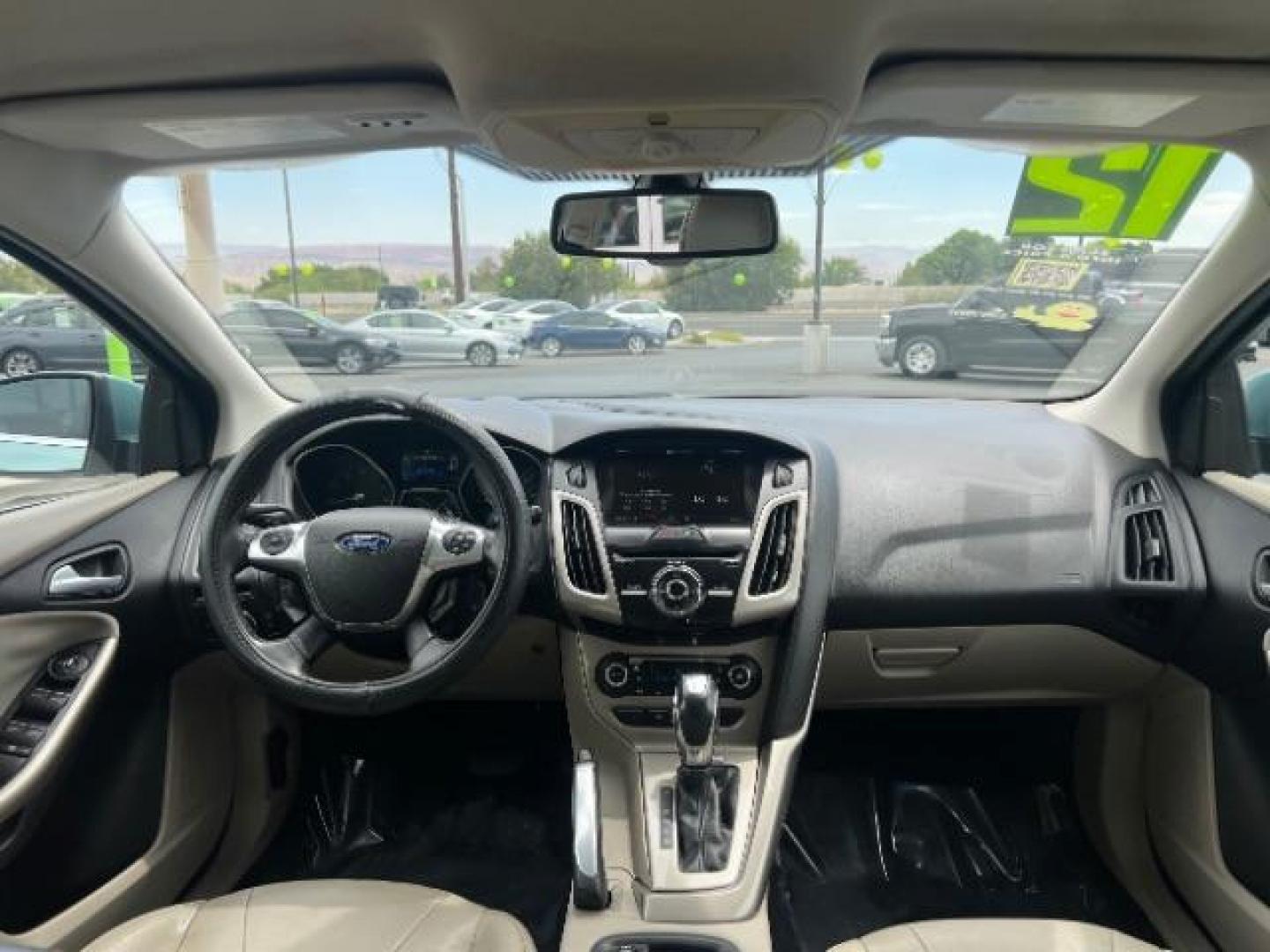2012 Frosted Glass /Medium Light Stone C Ford Focus SEL (1FAHP3M20CL) with an 2.0L L4 DOHC 16V engine, 6-Speed Automatic transmission, located at 940 North Main Street, Cedar City, UT, 84720, (435) 628-0023, 37.692936, -113.061897 - We specialize in helping ALL people get the best financing available. No matter your credit score, good, bad or none we can get you an amazing rate. Had a bankruptcy, divorce, or repossessions? We give you the green light to get your credit back on the road. Low down and affordable payments that fit - Photo#23