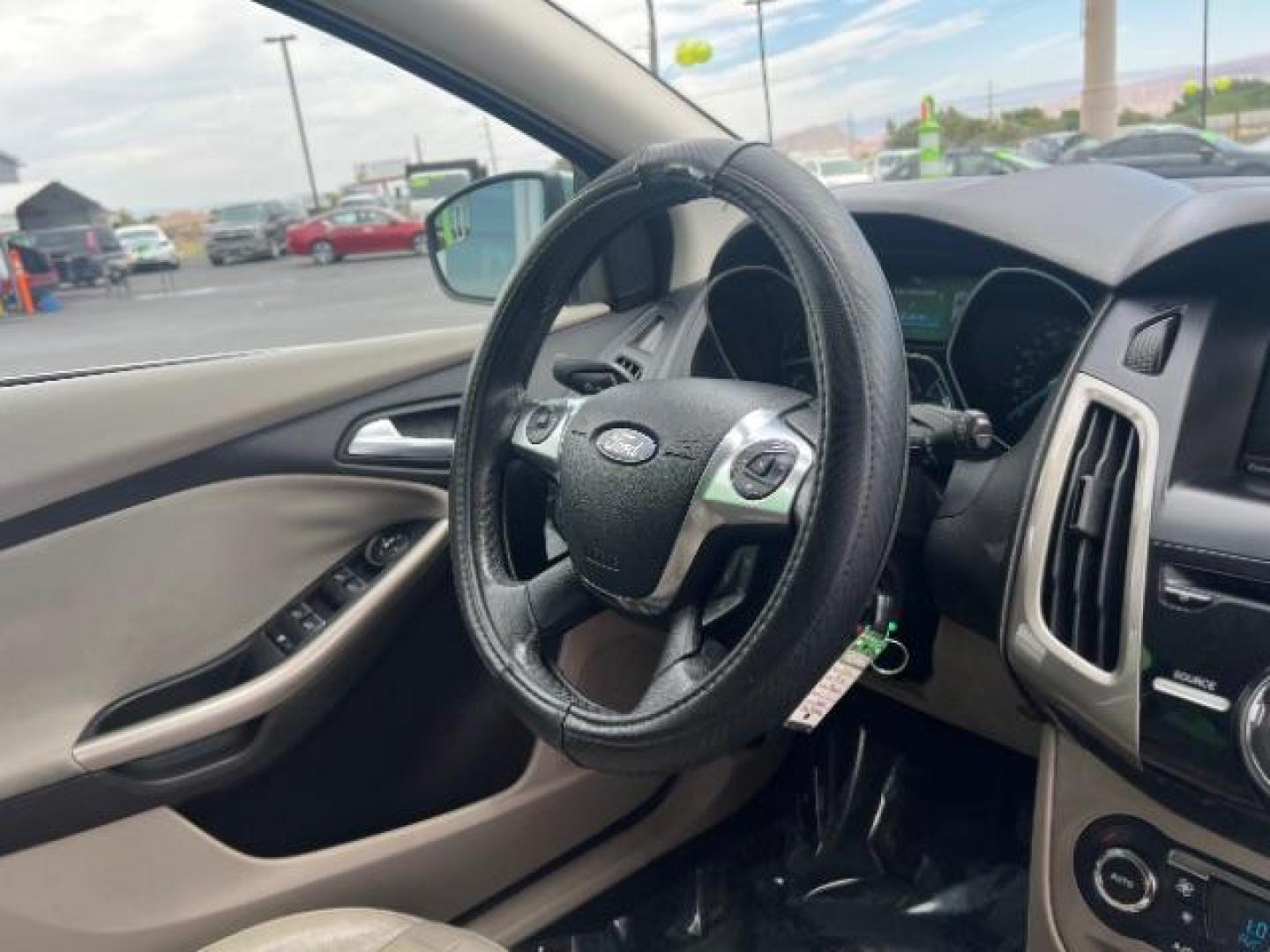 2012 Frosted Glass /Medium Light Stone C Ford Focus SEL (1FAHP3M20CL) with an 2.0L L4 DOHC 16V engine, 6-Speed Automatic transmission, located at 940 North Main Street, Cedar City, UT, 84720, (435) 628-0023, 37.692936, -113.061897 - We specialize in helping ALL people get the best financing available. No matter your credit score, good, bad or none we can get you an amazing rate. Had a bankruptcy, divorce, or repossessions? We give you the green light to get your credit back on the road. Low down and affordable payments that fit - Photo#31