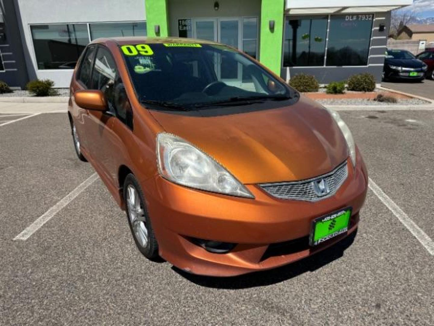 2009 Orange Revolution Me /Black Cloth Interior Honda Fit Sport 5-Speed AT (JHMGE88409S) with an 1.5L L4 SOHC 16V engine, 5-Speed Automatic transmission, located at 1865 East Red Hills Pkwy, St. George, 84770, (435) 628-0023, 37.120850, -113.543640 - We specialize in helping ALL people get the best financing available. No matter your credit score, good, bad or none we can get you an amazing rate. Had a bankruptcy, divorce, or repossessions? We give you the green light to get your credit back on the road. Low down and affordable payments that fit - Photo#1