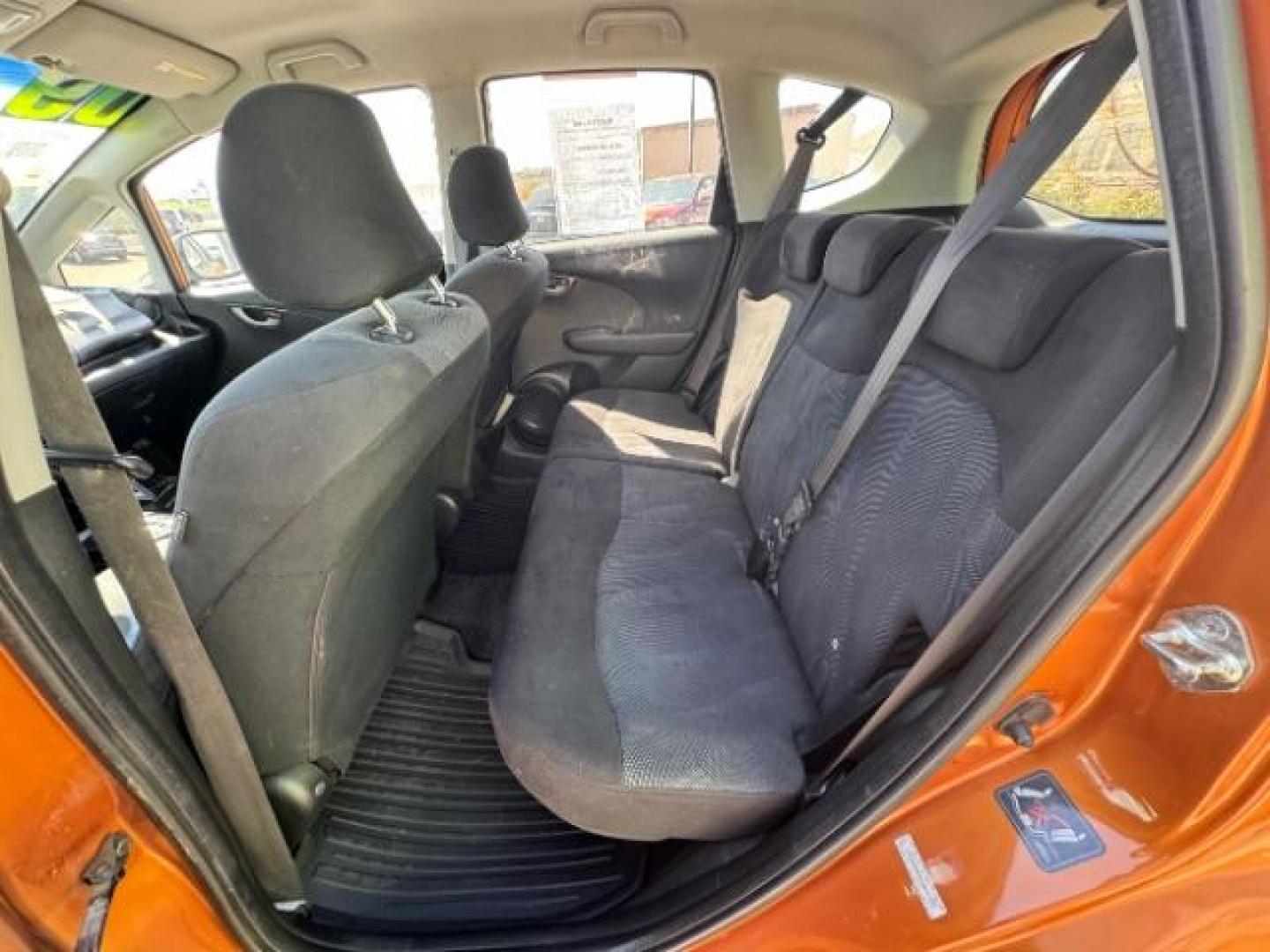 2009 Orange Revolution Me /Black Cloth Interior Honda Fit Sport 5-Speed AT (JHMGE88409S) with an 1.5L L4 SOHC 16V engine, 5-Speed Automatic transmission, located at 1865 East Red Hills Pkwy, St. George, 84770, (435) 628-0023, 37.120850, -113.543640 - We specialize in helping ALL people get the best financing available. No matter your credit score, good, bad or none we can get you an amazing rate. Had a bankruptcy, divorce, or repossessions? We give you the green light to get your credit back on the road. Low down and affordable payments that fit - Photo#24