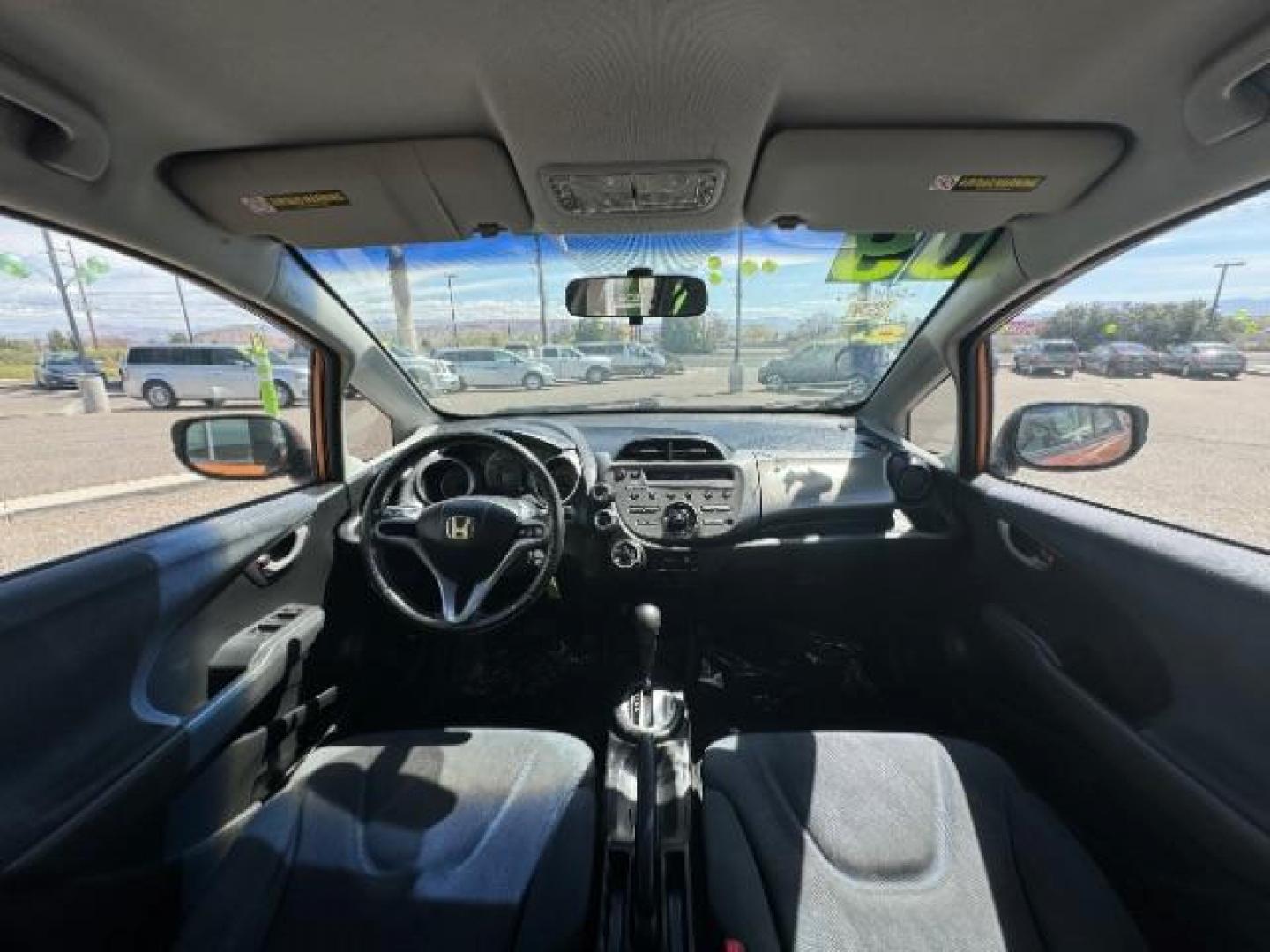 2009 Orange Revolution Me /Black Cloth Interior Honda Fit Sport 5-Speed AT (JHMGE88409S) with an 1.5L L4 SOHC 16V engine, 5-Speed Automatic transmission, located at 1865 East Red Hills Pkwy, St. George, 84770, (435) 628-0023, 37.120850, -113.543640 - We specialize in helping ALL people get the best financing available. No matter your credit score, good, bad or none we can get you an amazing rate. Had a bankruptcy, divorce, or repossessions? We give you the green light to get your credit back on the road. Low down and affordable payments that fit - Photo#25