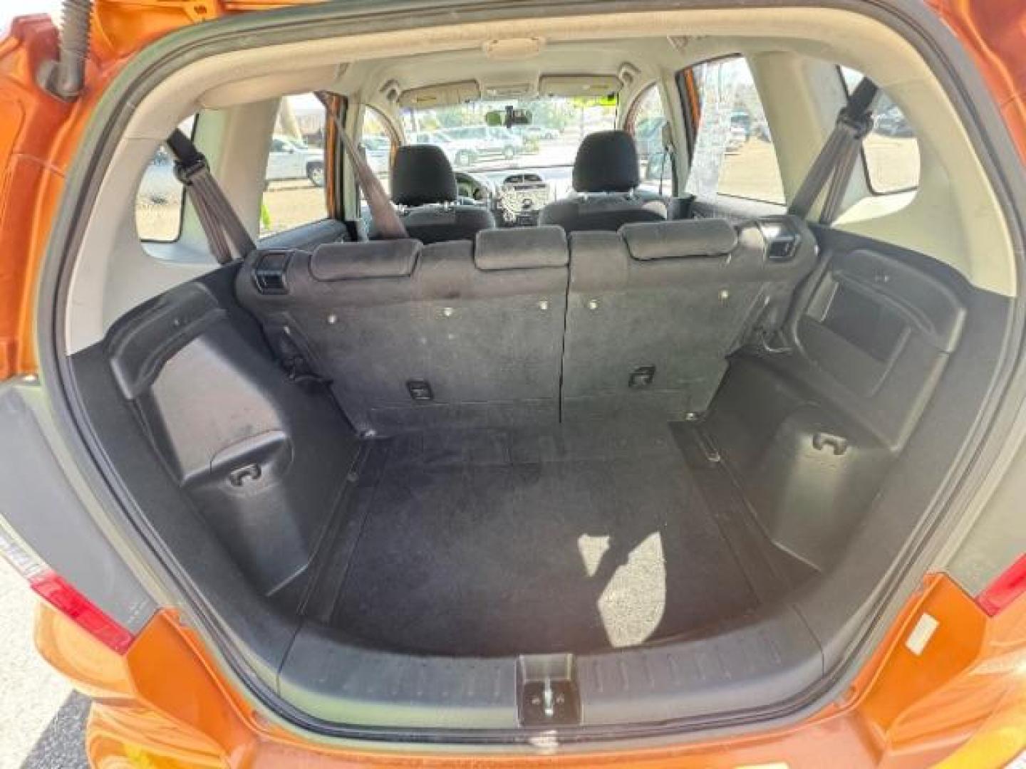 2009 Orange Revolution Me /Black Cloth Interior Honda Fit Sport 5-Speed AT (JHMGE88409S) with an 1.5L L4 SOHC 16V engine, 5-Speed Automatic transmission, located at 1865 East Red Hills Pkwy, St. George, 84770, (435) 628-0023, 37.120850, -113.543640 - We specialize in helping ALL people get the best financing available. No matter your credit score, good, bad or none we can get you an amazing rate. Had a bankruptcy, divorce, or repossessions? We give you the green light to get your credit back on the road. Low down and affordable payments that fit - Photo#26
