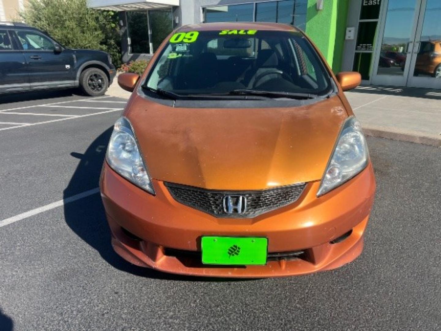 2009 Orange Revolution Metallic /Black Cloth Interior Honda Fit Sport 5-Speed AT (JHMGE88409S) with an 1.5L L4 SOHC 16V engine, 5-Speed Automatic transmission, located at 1865 East Red Hills Pkwy, St. George, 84770, (435) 628-0023, 37.120850, -113.543640 - We specialize in helping ALL people get the best financing available. No matter your credit score, good, bad or none we can get you an amazing rate. Had a bankruptcy, divorce, or repossessions? We give you the green light to get your credit back on the road. Low down and affordable payments that fit- Photo#1