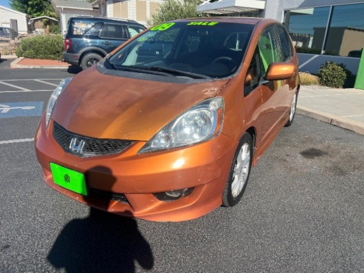 2009 Orange Revolution Metallic /Black Cloth Interior Honda Fit Sport 5-Speed AT (JHMGE88409S) with an 1.5L L4 SOHC 16V engine, 5-Speed Automatic transmission, located at 1865 East Red Hills Pkwy, St. George, 84770, (435) 628-0023, 37.120850, -113.543640 - We specialize in helping ALL people get the best financing available. No matter your credit score, good, bad or none we can get you an amazing rate. Had a bankruptcy, divorce, or repossessions? We give you the green light to get your credit back on the road. Low down and affordable payments that fit- Photo#2