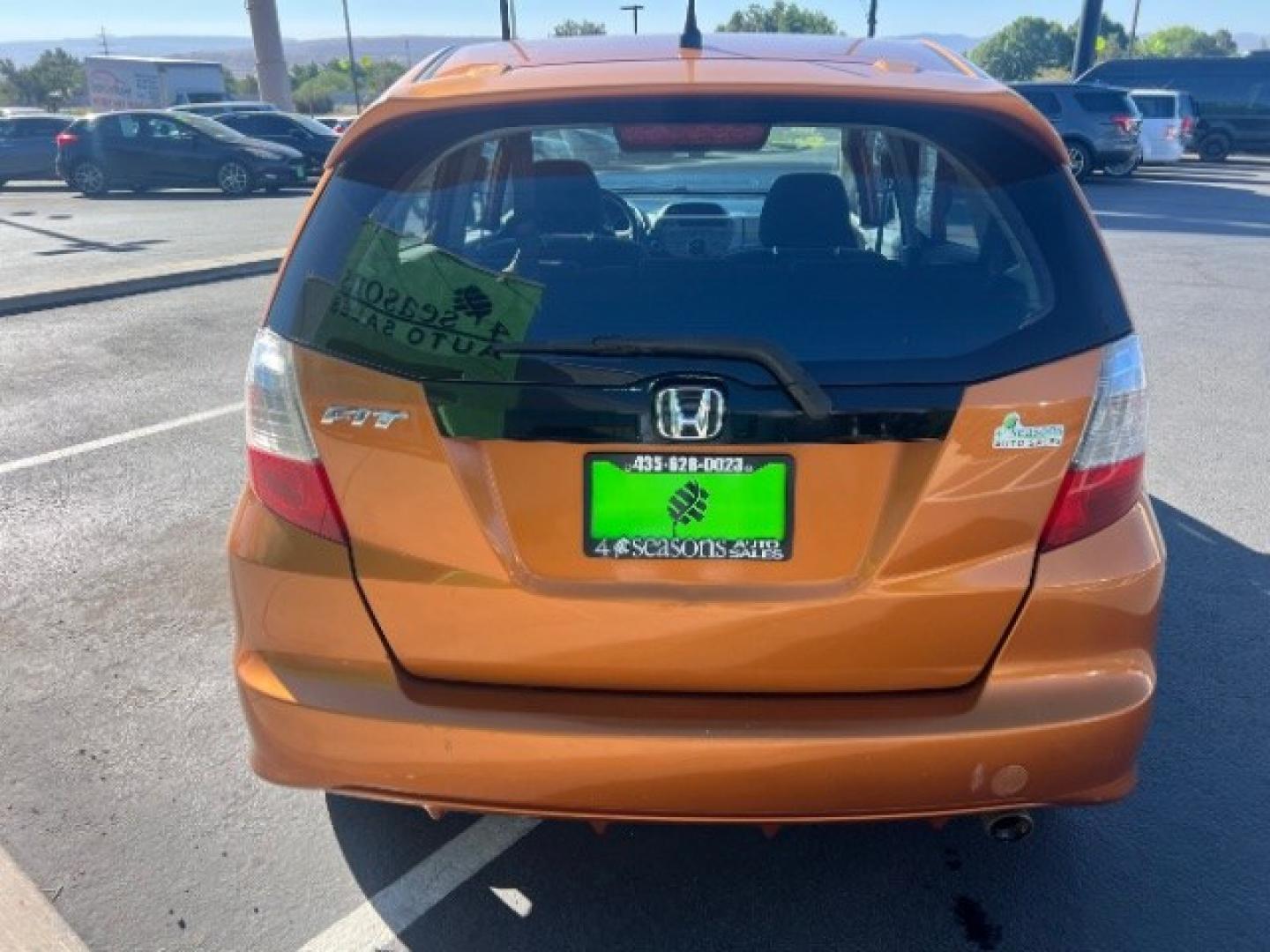2009 Orange Revolution Metallic /Black Cloth Interior Honda Fit Sport 5-Speed AT (JHMGE88409S) with an 1.5L L4 SOHC 16V engine, 5-Speed Automatic transmission, located at 1865 East Red Hills Pkwy, St. George, 84770, (435) 628-0023, 37.120850, -113.543640 - We specialize in helping ALL people get the best financing available. No matter your credit score, good, bad or none we can get you an amazing rate. Had a bankruptcy, divorce, or repossessions? We give you the green light to get your credit back on the road. Low down and affordable payments that fit- Photo#5