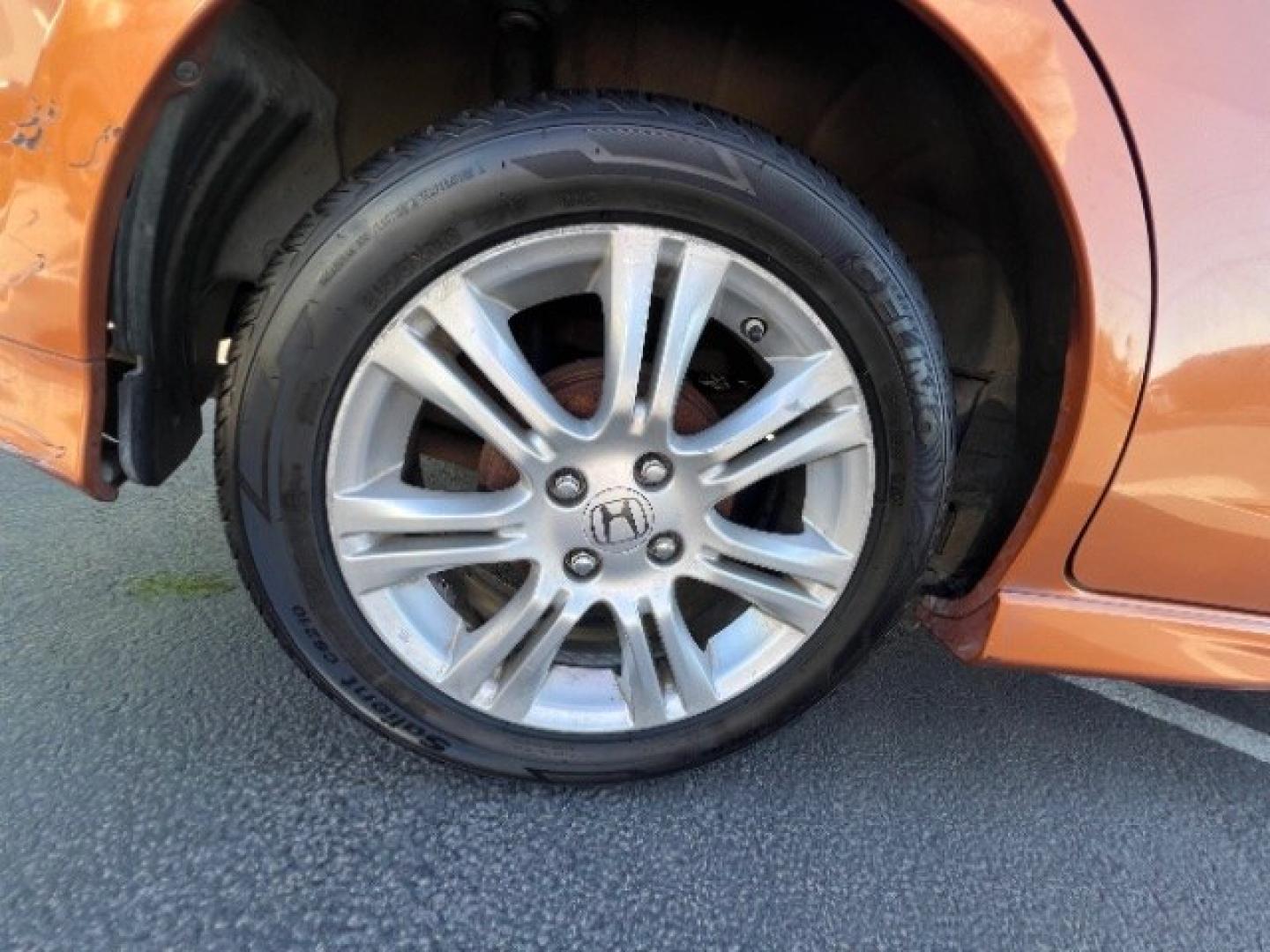 2009 Orange Revolution Metallic /Black Cloth Interior Honda Fit Sport 5-Speed AT (JHMGE88409S) with an 1.5L L4 SOHC 16V engine, 5-Speed Automatic transmission, located at 1865 East Red Hills Pkwy, St. George, 84770, (435) 628-0023, 37.120850, -113.543640 - We specialize in helping ALL people get the best financing available. No matter your credit score, good, bad or none we can get you an amazing rate. Had a bankruptcy, divorce, or repossessions? We give you the green light to get your credit back on the road. Low down and affordable payments that fit- Photo#8