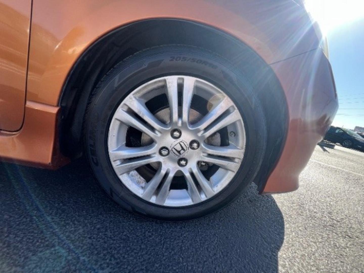 2009 Orange Revolution Metallic /Black Cloth Interior Honda Fit Sport 5-Speed AT (JHMGE88409S) with an 1.5L L4 SOHC 16V engine, 5-Speed Automatic transmission, located at 1865 East Red Hills Pkwy, St. George, 84770, (435) 628-0023, 37.120850, -113.543640 - We specialize in helping ALL people get the best financing available. No matter your credit score, good, bad or none we can get you an amazing rate. Had a bankruptcy, divorce, or repossessions? We give you the green light to get your credit back on the road. Low down and affordable payments that fit- Photo#9