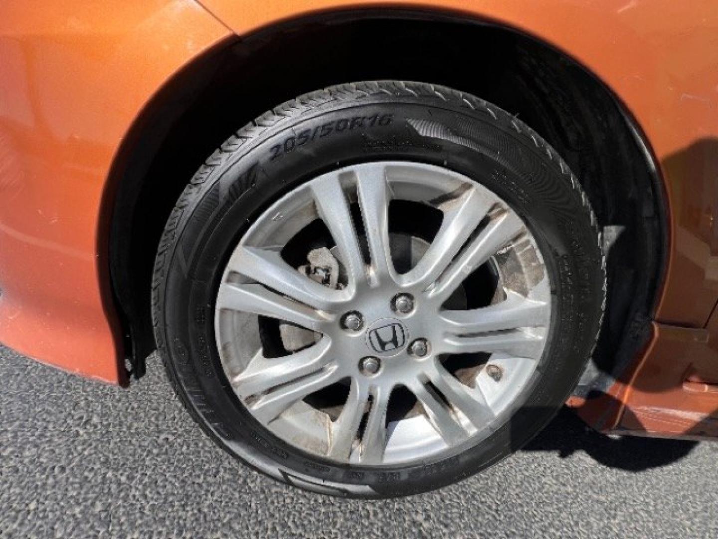 2009 Orange Revolution Metallic /Black Cloth Interior Honda Fit Sport 5-Speed AT (JHMGE88409S) with an 1.5L L4 SOHC 16V engine, 5-Speed Automatic transmission, located at 1865 East Red Hills Pkwy, St. George, 84770, (435) 628-0023, 37.120850, -113.543640 - We specialize in helping ALL people get the best financing available. No matter your credit score, good, bad or none we can get you an amazing rate. Had a bankruptcy, divorce, or repossessions? We give you the green light to get your credit back on the road. Low down and affordable payments that fit- Photo#10