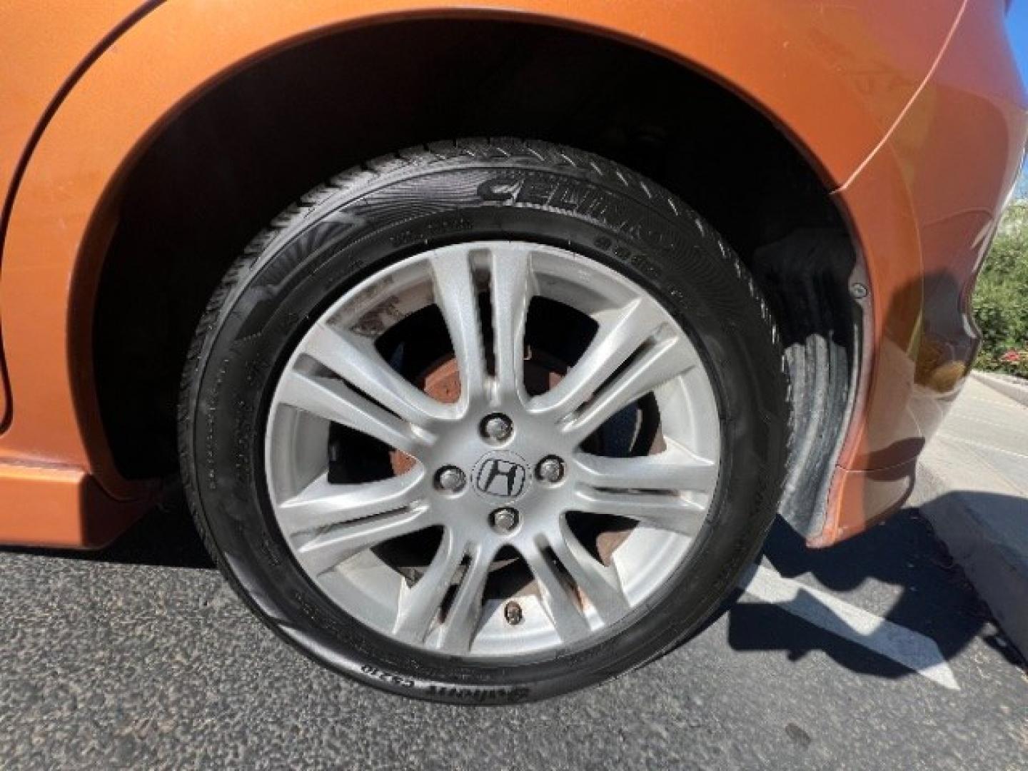 2009 Orange Revolution Metallic /Black Cloth Interior Honda Fit Sport 5-Speed AT (JHMGE88409S) with an 1.5L L4 SOHC 16V engine, 5-Speed Automatic transmission, located at 1865 East Red Hills Pkwy, St. George, 84770, (435) 628-0023, 37.120850, -113.543640 - We specialize in helping ALL people get the best financing available. No matter your credit score, good, bad or none we can get you an amazing rate. Had a bankruptcy, divorce, or repossessions? We give you the green light to get your credit back on the road. Low down and affordable payments that fit- Photo#11
