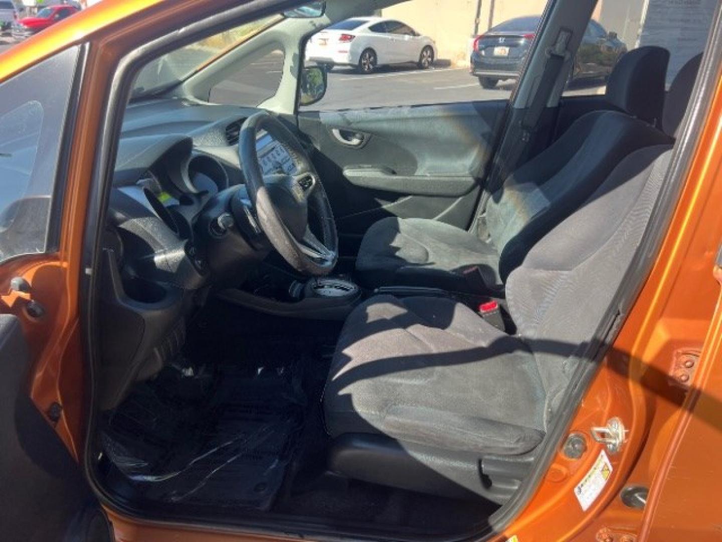 2009 Orange Revolution Metallic /Black Cloth Interior Honda Fit Sport 5-Speed AT (JHMGE88409S) with an 1.5L L4 SOHC 16V engine, 5-Speed Automatic transmission, located at 1865 East Red Hills Pkwy, St. George, 84770, (435) 628-0023, 37.120850, -113.543640 - We specialize in helping ALL people get the best financing available. No matter your credit score, good, bad or none we can get you an amazing rate. Had a bankruptcy, divorce, or repossessions? We give you the green light to get your credit back on the road. Low down and affordable payments that fit- Photo#14
