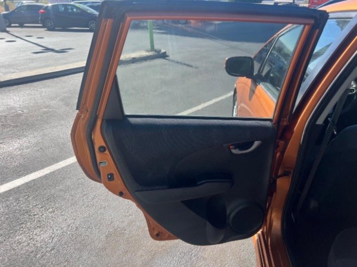 2009 Orange Revolution Metallic /Black Cloth Interior Honda Fit Sport 5-Speed AT (JHMGE88409S) with an 1.5L L4 SOHC 16V engine, 5-Speed Automatic transmission, located at 1865 East Red Hills Pkwy, St. George, 84770, (435) 628-0023, 37.120850, -113.543640 - We specialize in helping ALL people get the best financing available. No matter your credit score, good, bad or none we can get you an amazing rate. Had a bankruptcy, divorce, or repossessions? We give you the green light to get your credit back on the road. Low down and affordable payments that fit- Photo#19