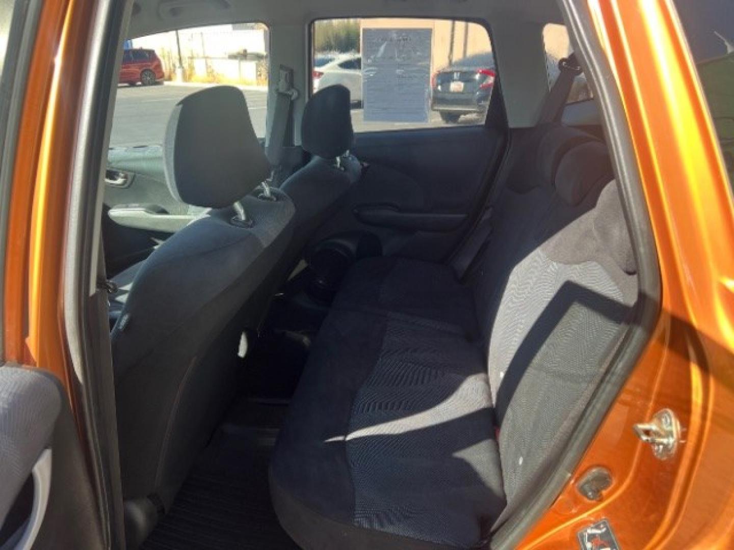 2009 Orange Revolution Metallic /Black Cloth Interior Honda Fit Sport 5-Speed AT (JHMGE88409S) with an 1.5L L4 SOHC 16V engine, 5-Speed Automatic transmission, located at 1865 East Red Hills Pkwy, St. George, 84770, (435) 628-0023, 37.120850, -113.543640 - We specialize in helping ALL people get the best financing available. No matter your credit score, good, bad or none we can get you an amazing rate. Had a bankruptcy, divorce, or repossessions? We give you the green light to get your credit back on the road. Low down and affordable payments that fit- Photo#20