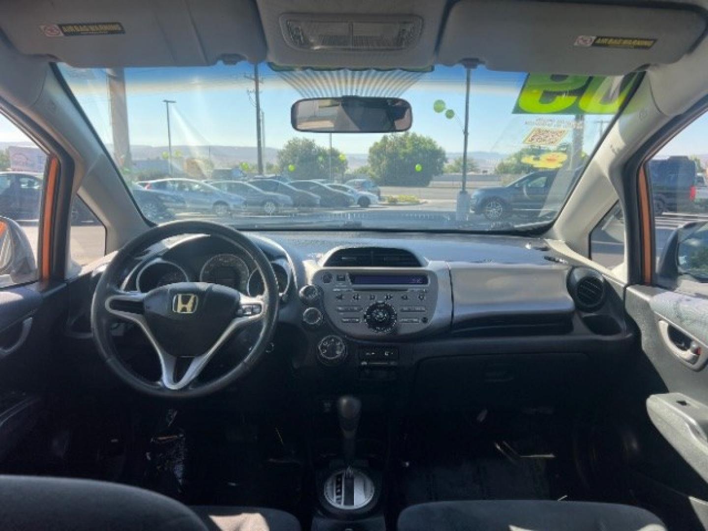 2009 Orange Revolution Metallic /Black Cloth Interior Honda Fit Sport 5-Speed AT (JHMGE88409S) with an 1.5L L4 SOHC 16V engine, 5-Speed Automatic transmission, located at 1865 East Red Hills Pkwy, St. George, 84770, (435) 628-0023, 37.120850, -113.543640 - We specialize in helping ALL people get the best financing available. No matter your credit score, good, bad or none we can get you an amazing rate. Had a bankruptcy, divorce, or repossessions? We give you the green light to get your credit back on the road. Low down and affordable payments that fit- Photo#21