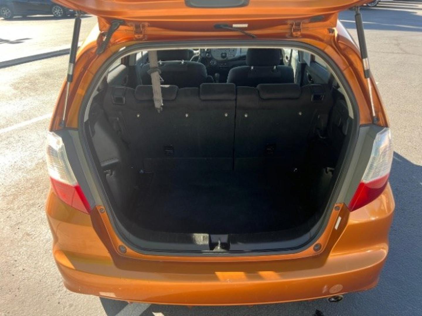 2009 Orange Revolution Metallic /Black Cloth Interior Honda Fit Sport 5-Speed AT (JHMGE88409S) with an 1.5L L4 SOHC 16V engine, 5-Speed Automatic transmission, located at 1865 East Red Hills Pkwy, St. George, 84770, (435) 628-0023, 37.120850, -113.543640 - We specialize in helping ALL people get the best financing available. No matter your credit score, good, bad or none we can get you an amazing rate. Had a bankruptcy, divorce, or repossessions? We give you the green light to get your credit back on the road. Low down and affordable payments that fit- Photo#22