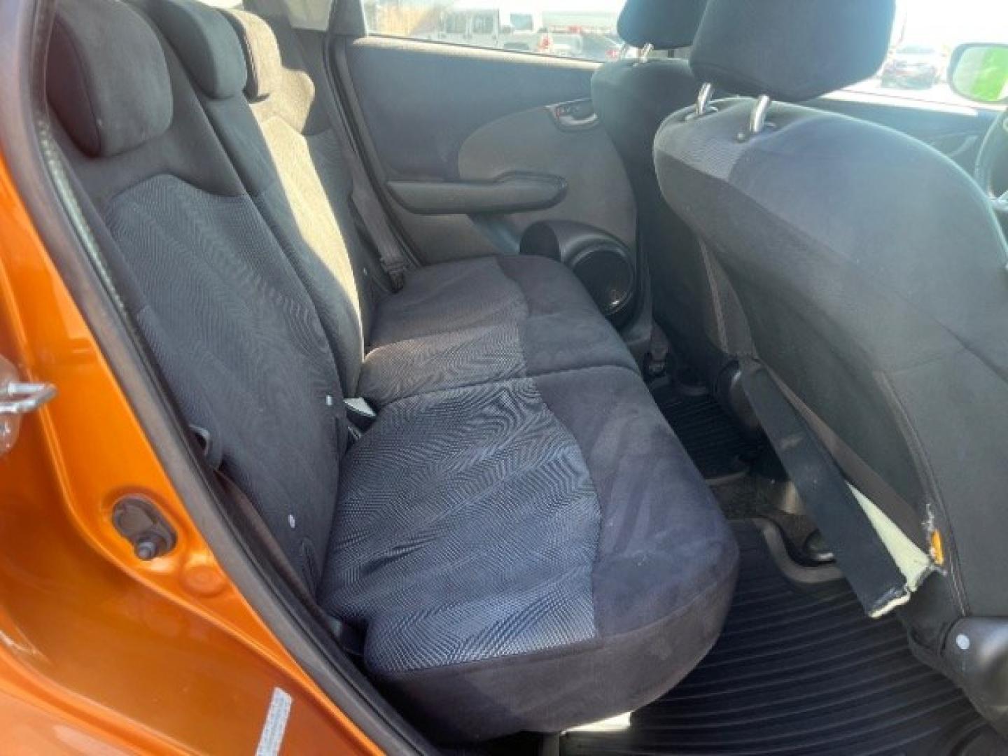 2009 Orange Revolution Metallic /Black Cloth Interior Honda Fit Sport 5-Speed AT (JHMGE88409S) with an 1.5L L4 SOHC 16V engine, 5-Speed Automatic transmission, located at 1865 East Red Hills Pkwy, St. George, 84770, (435) 628-0023, 37.120850, -113.543640 - We specialize in helping ALL people get the best financing available. No matter your credit score, good, bad or none we can get you an amazing rate. Had a bankruptcy, divorce, or repossessions? We give you the green light to get your credit back on the road. Low down and affordable payments that fit- Photo#24