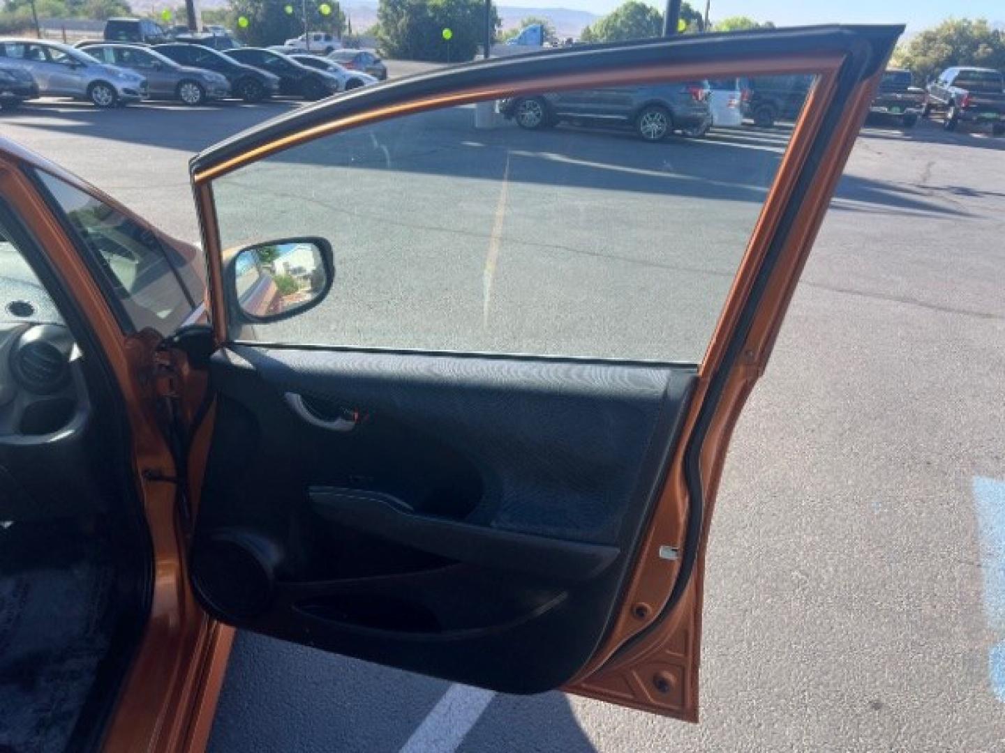 2009 Orange Revolution Metallic /Black Cloth Interior Honda Fit Sport 5-Speed AT (JHMGE88409S) with an 1.5L L4 SOHC 16V engine, 5-Speed Automatic transmission, located at 1865 East Red Hills Pkwy, St. George, 84770, (435) 628-0023, 37.120850, -113.543640 - We specialize in helping ALL people get the best financing available. No matter your credit score, good, bad or none we can get you an amazing rate. Had a bankruptcy, divorce, or repossessions? We give you the green light to get your credit back on the road. Low down and affordable payments that fit- Photo#25